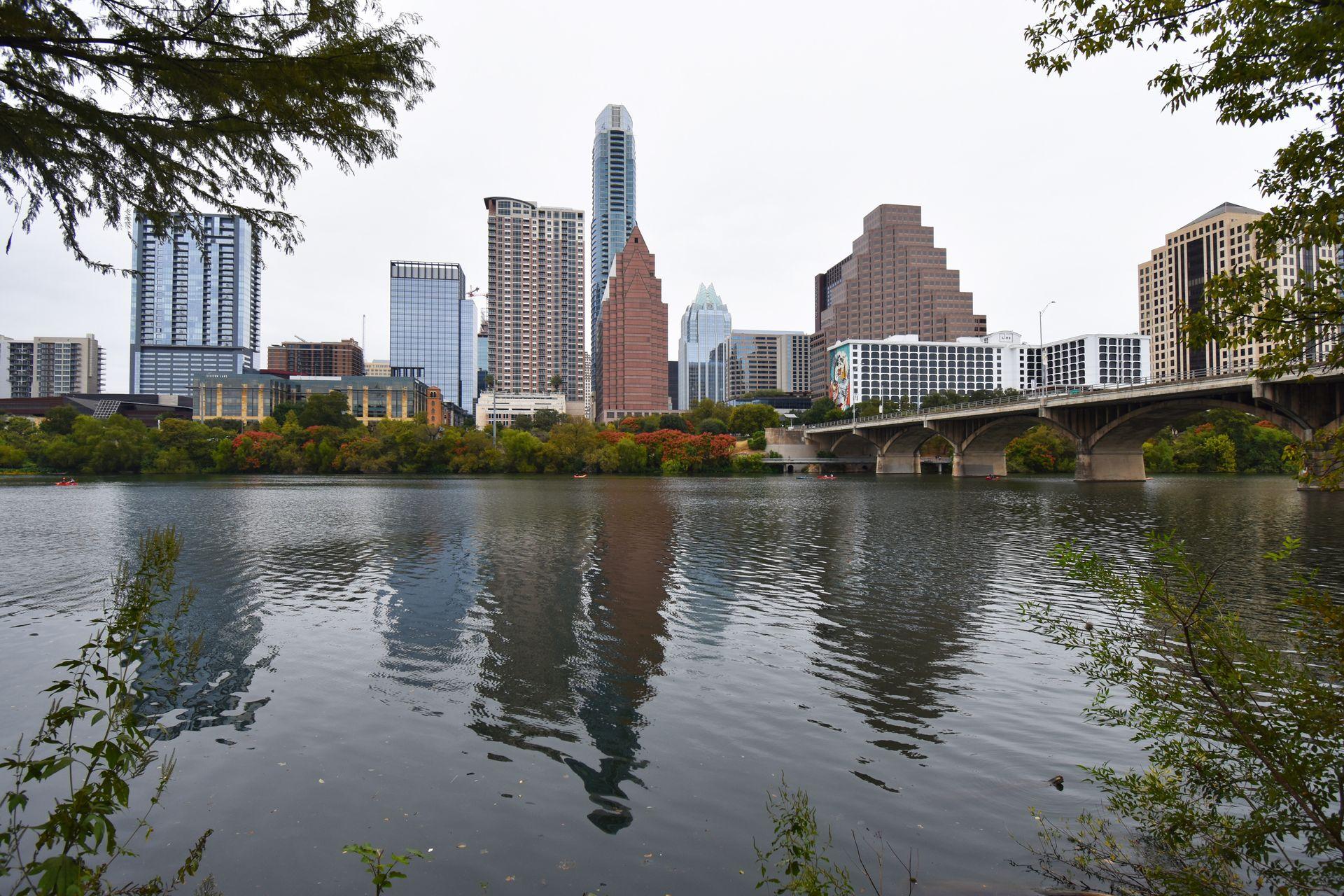 A view of downtown Austin from the south side of the river. South Congress Bridge is on the right.