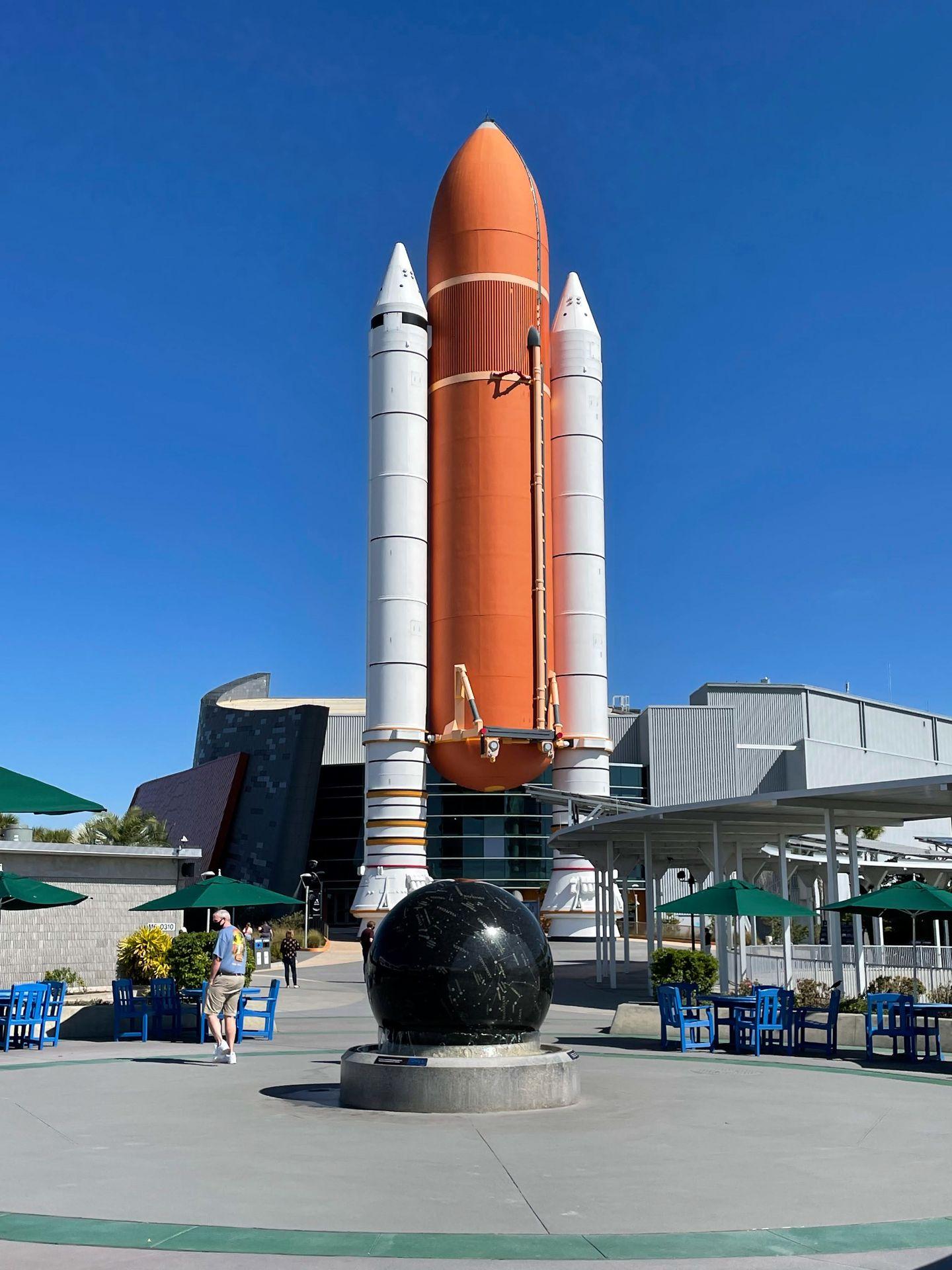 A large orange rocket standing up right.