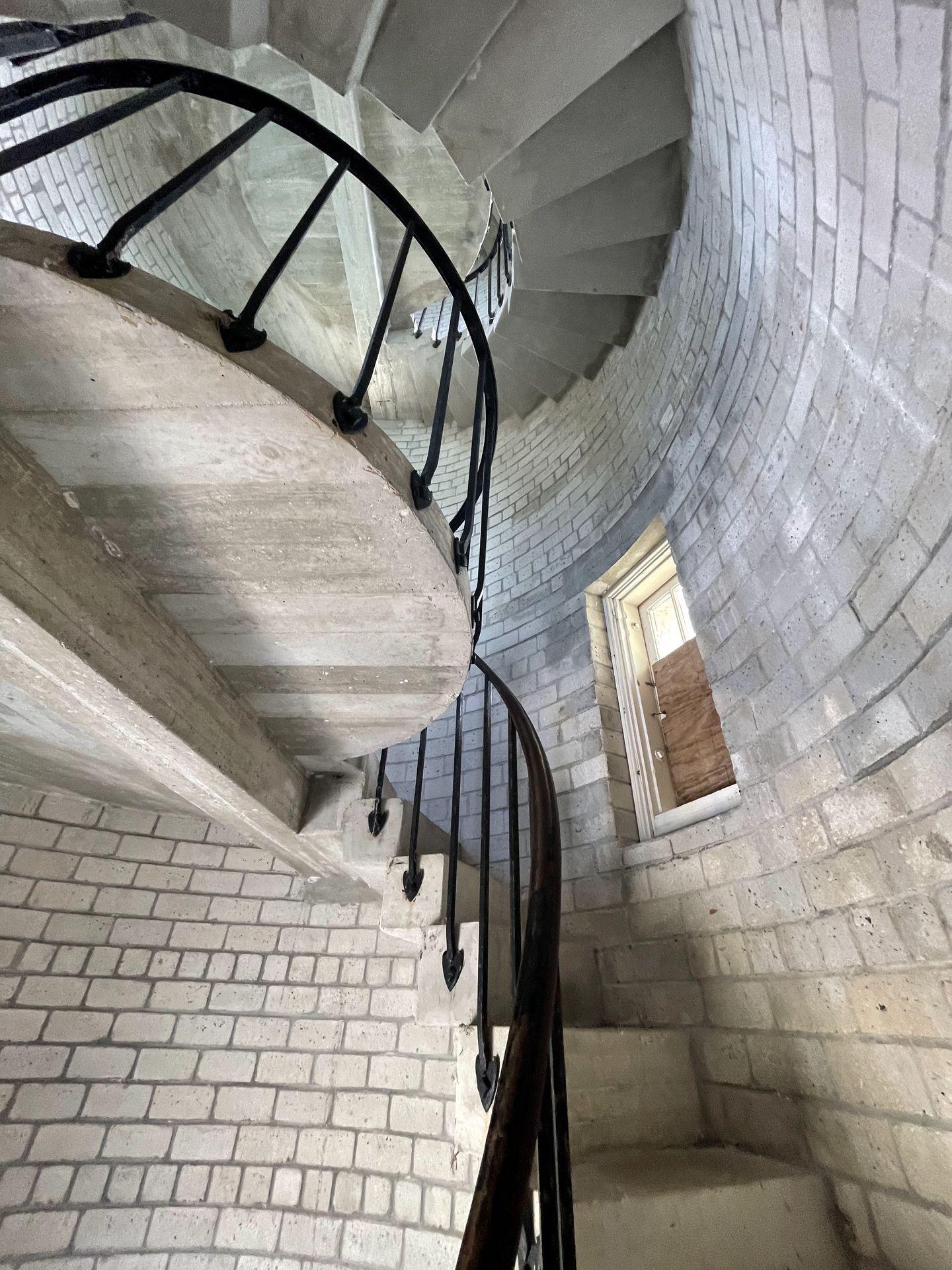 A spiral staircase inside of the lighthouse
