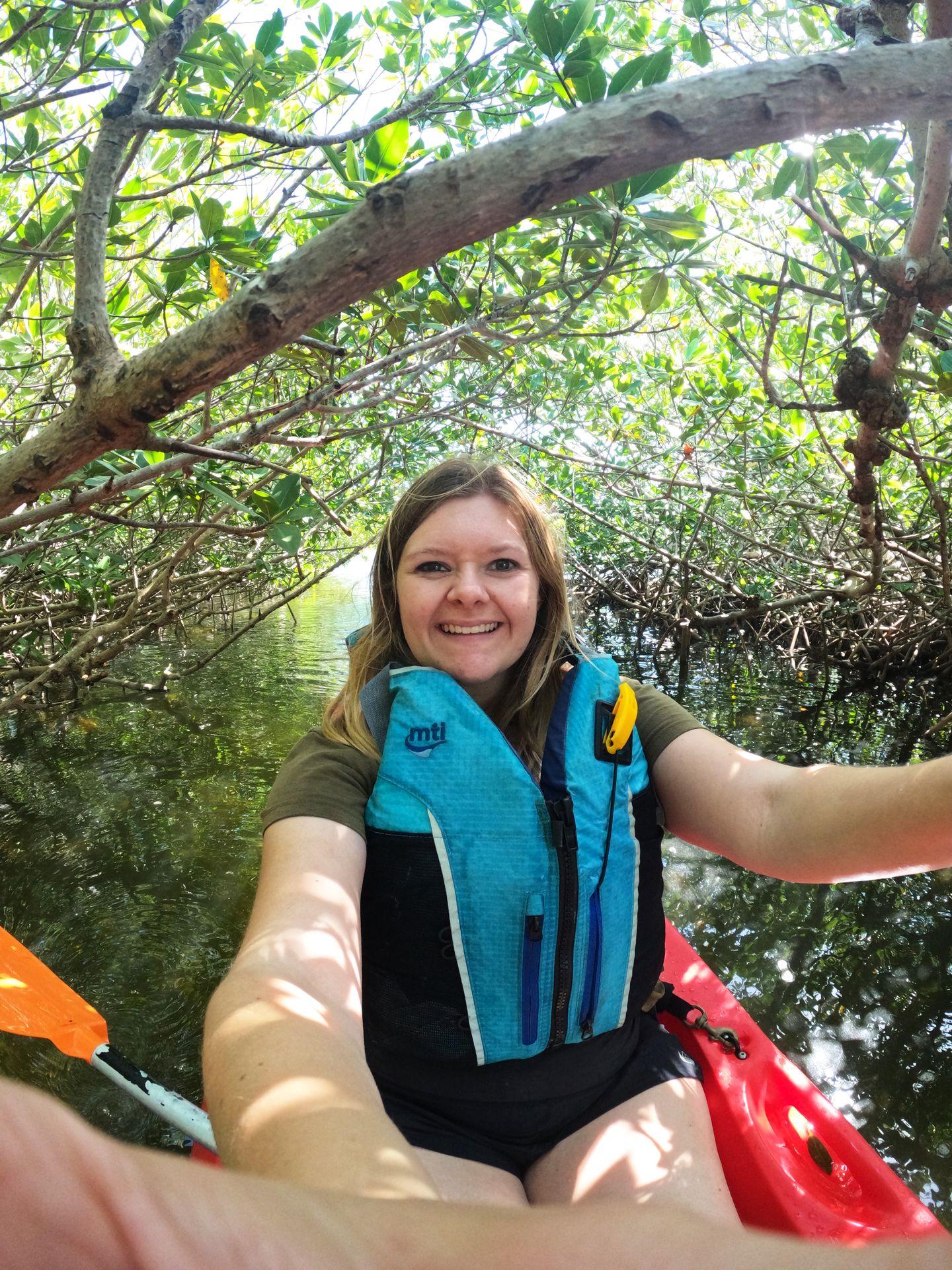 A selfie on Lydia kayaking through a mangrove tunnel at John Pennekamp State Park