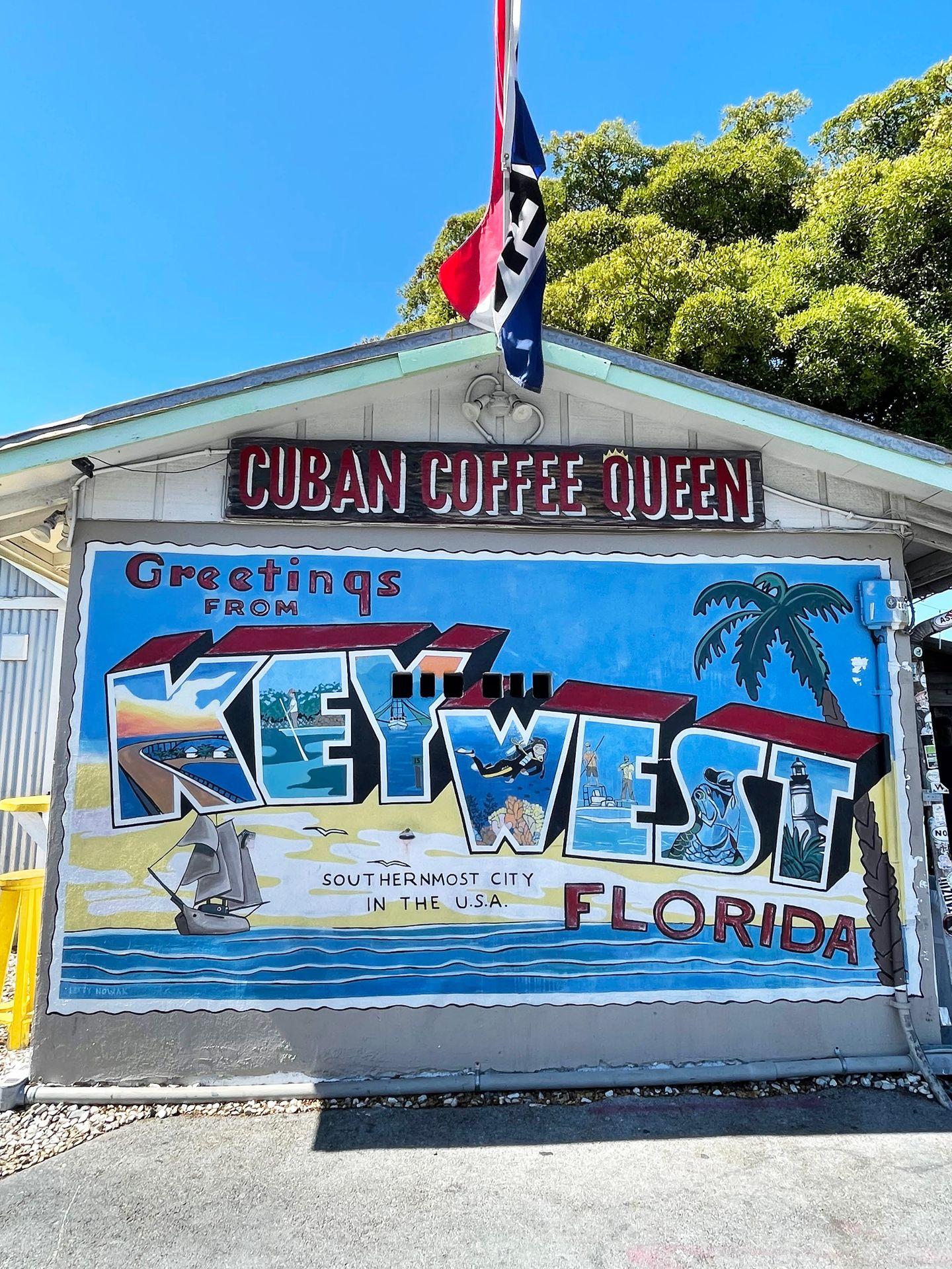 A 'Greetings from Key West' mural on the side of the Cuban Coffee Queen shack
