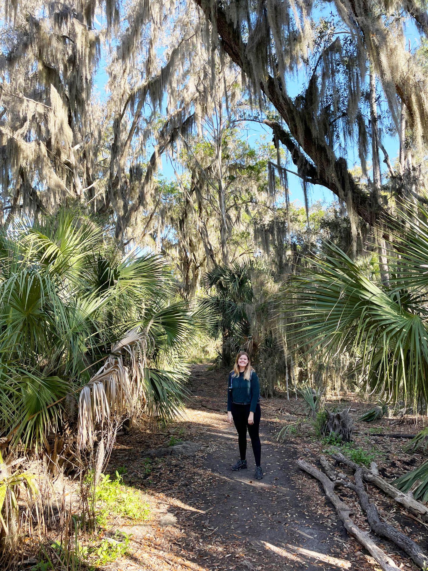 Lydia standing on a trail at Skidaway Island State Park