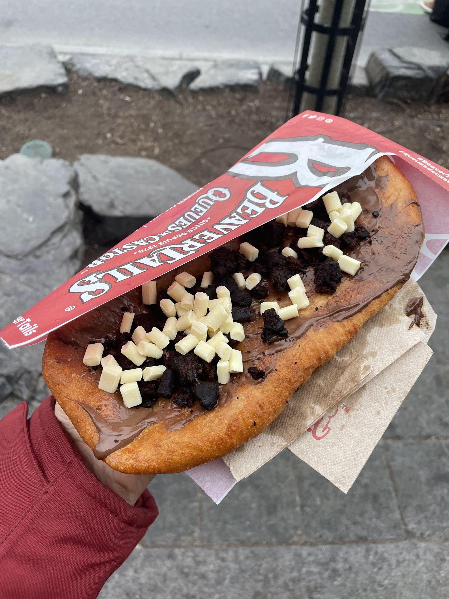 A BeaverTail pastry topped with nutella and chocolate chips.