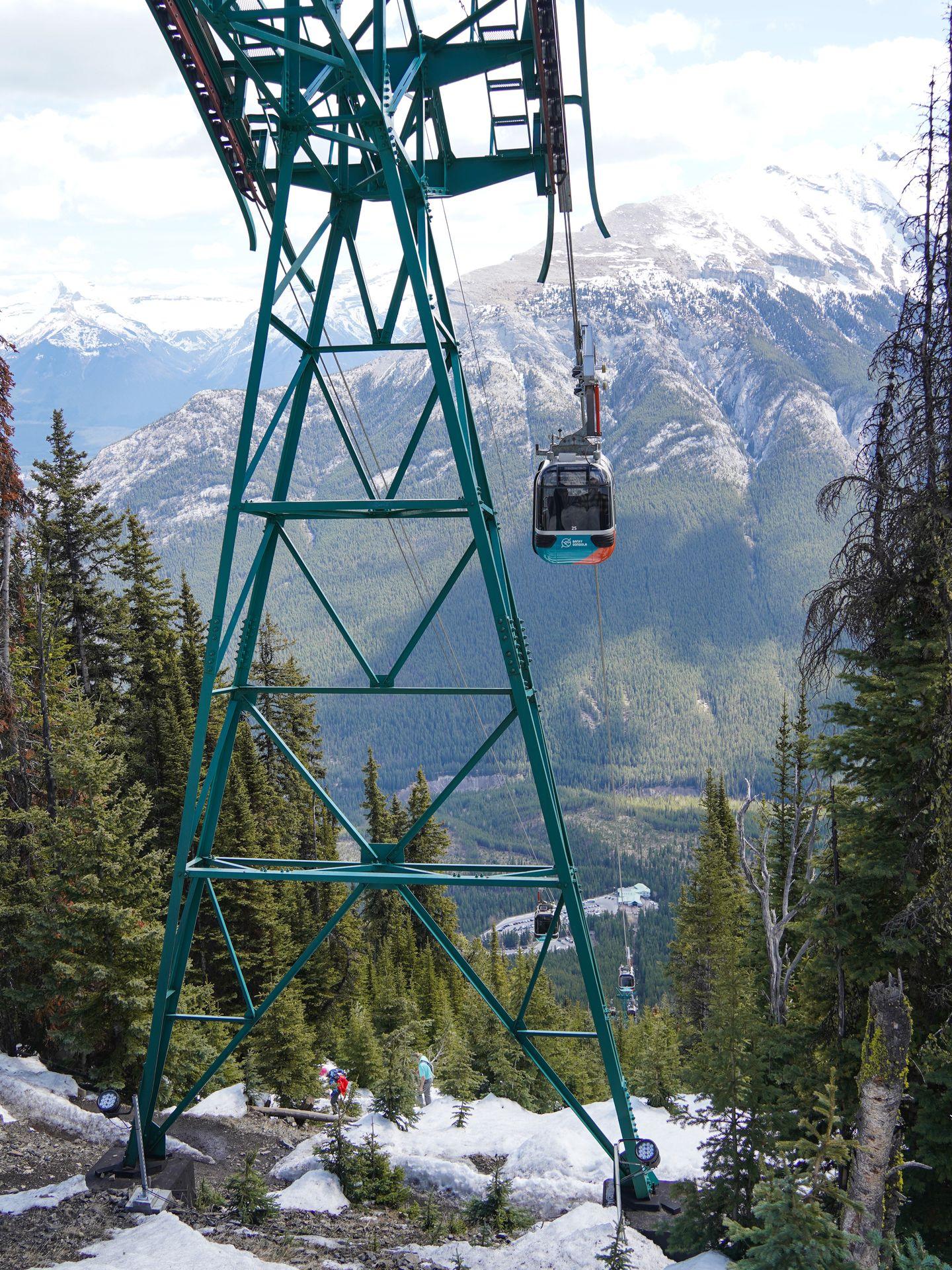 A view of the Sulphur Mountain Gondola. The tower is tall and green.