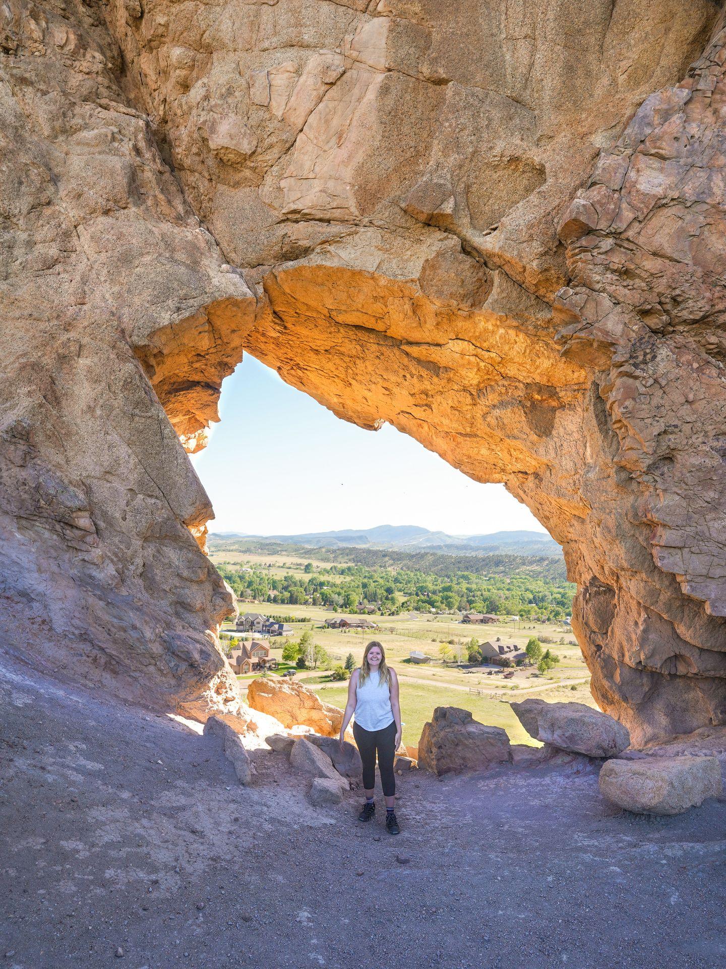 Lydia standing in front of the keyhole arch in the Devil's backbone Open Space.