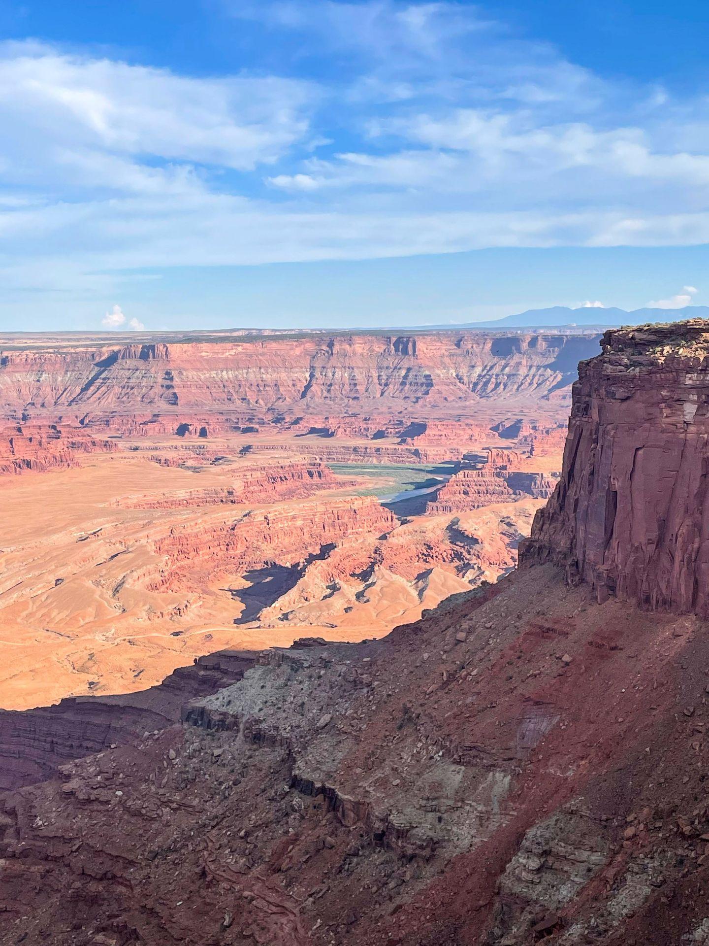 Looking out at a canyon from Dead Horse Point State Park. There is a bit of river in the view