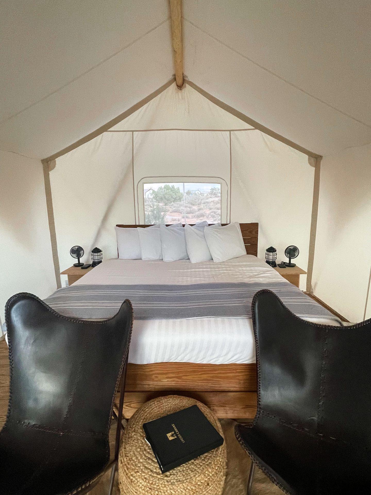 The interior of a standard safari tent at Under Canvas Moab