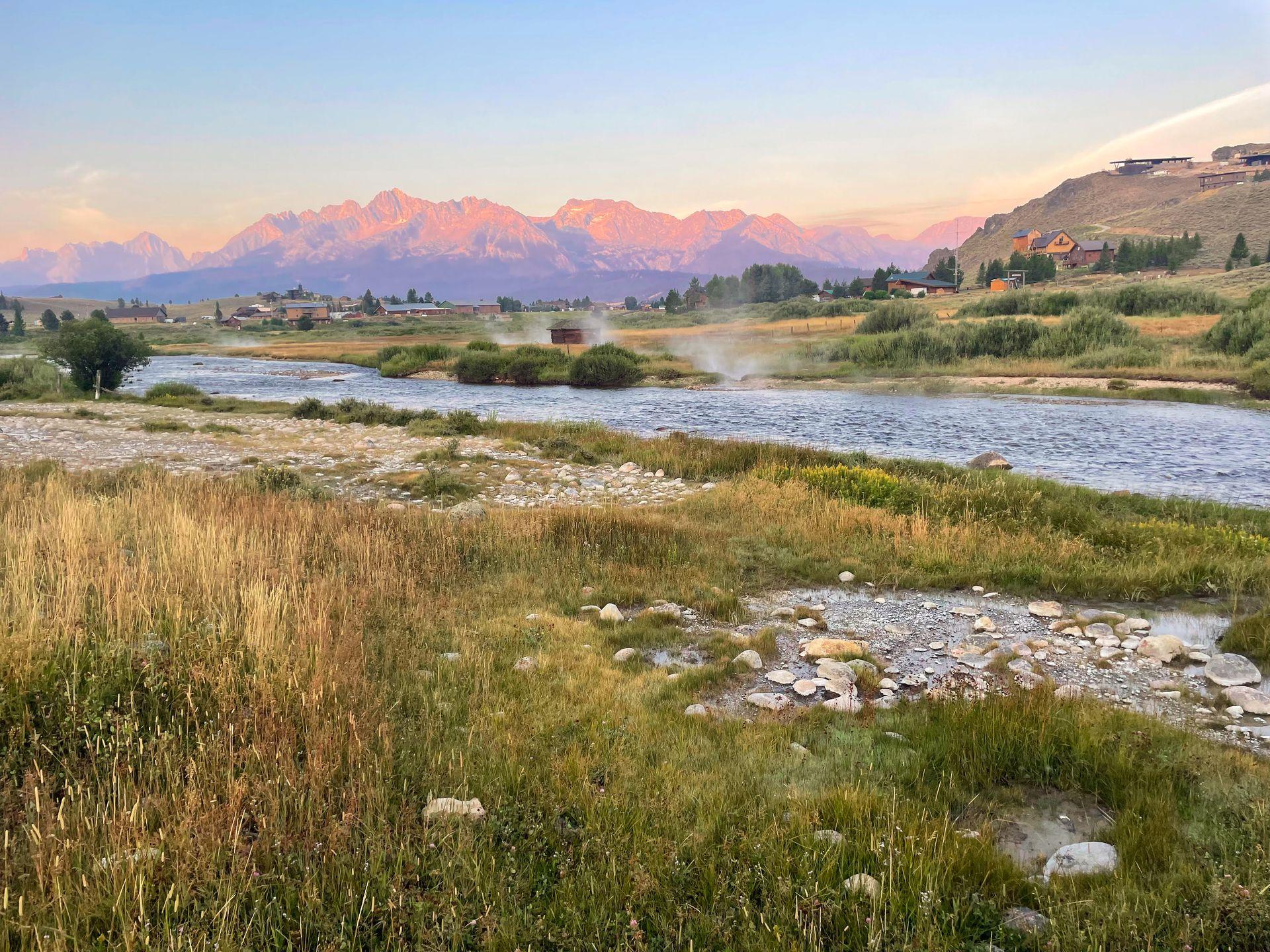 Looking out at the river and mountains from Valley Creek Hot Springs at sunrise.