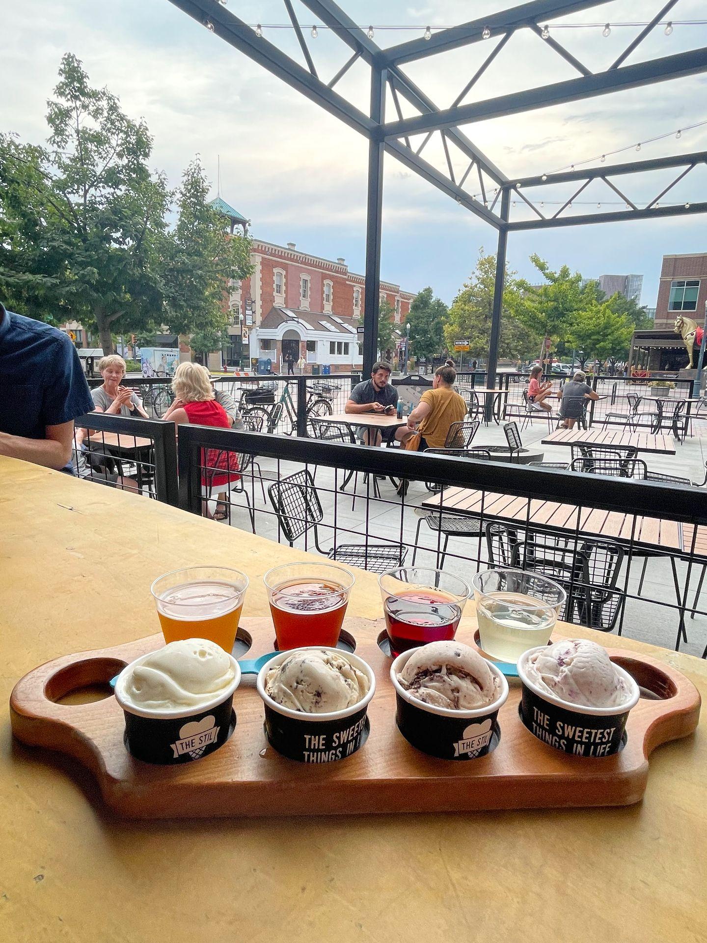 A side view of a flight with 4 ice cream flavors, two beers and two wines from The Stil.