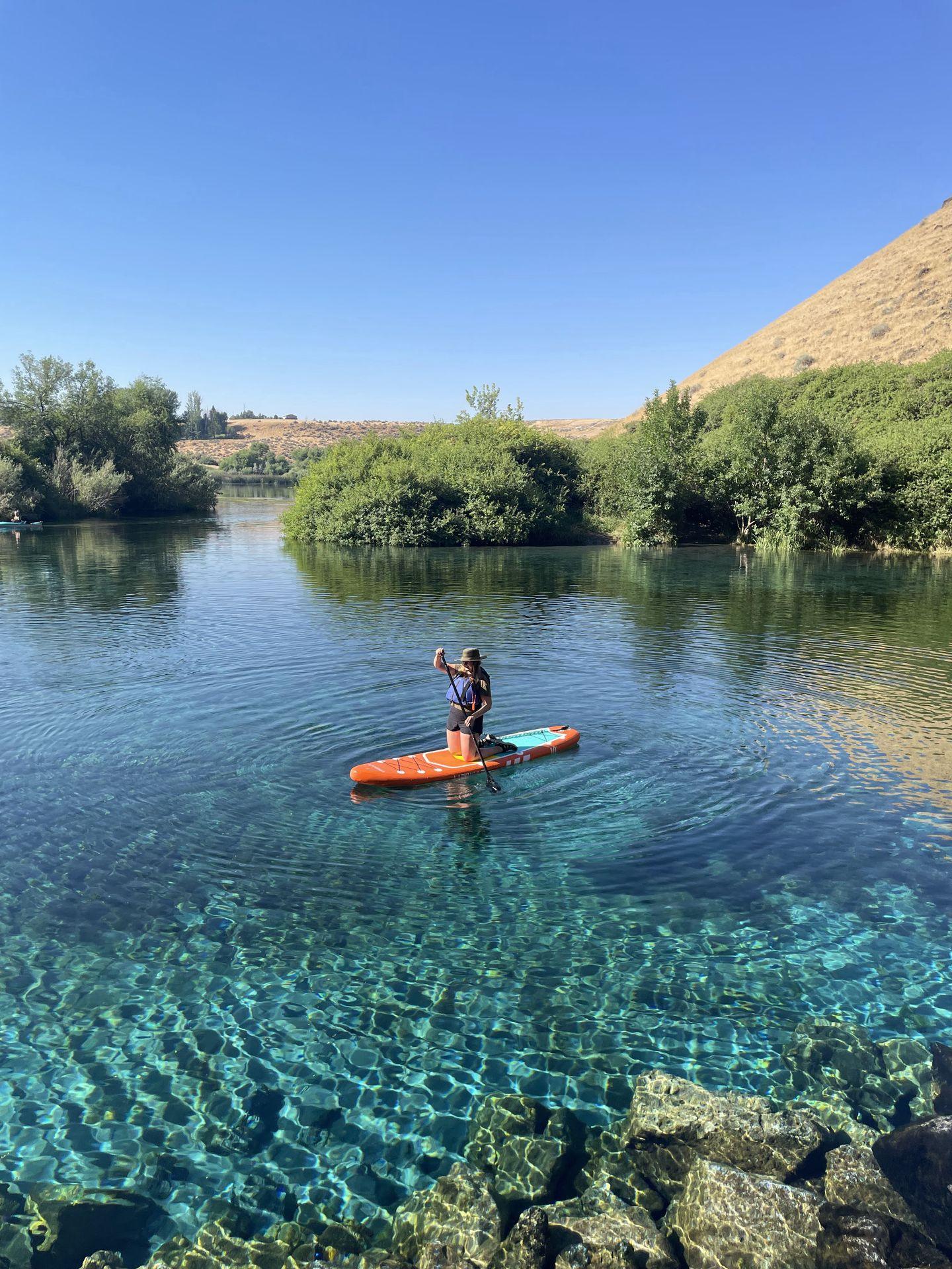Lydia paddling in Blue Heart Springs.