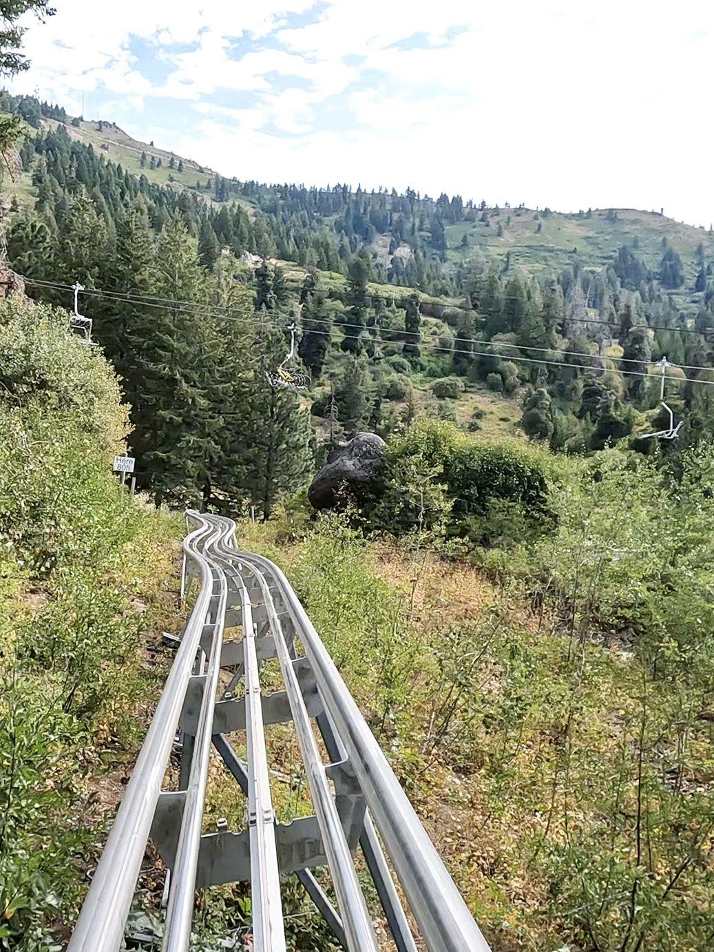 Looking at a silver coaster track while riding the Bogus Basin alpine coaster.