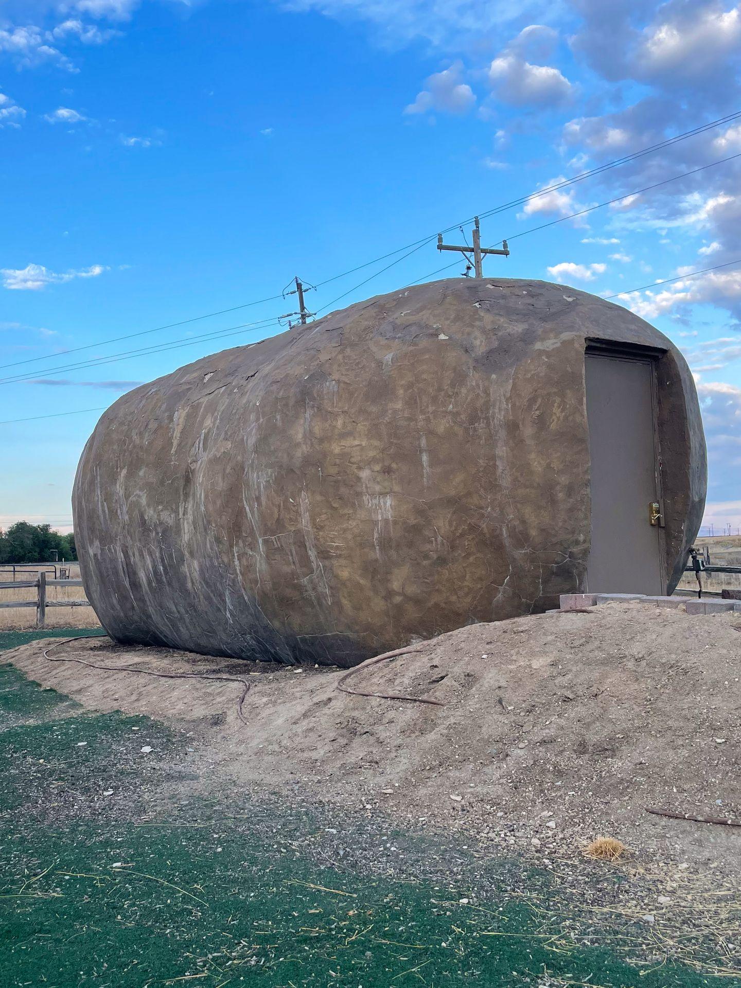 A giant potato with a door in the front.