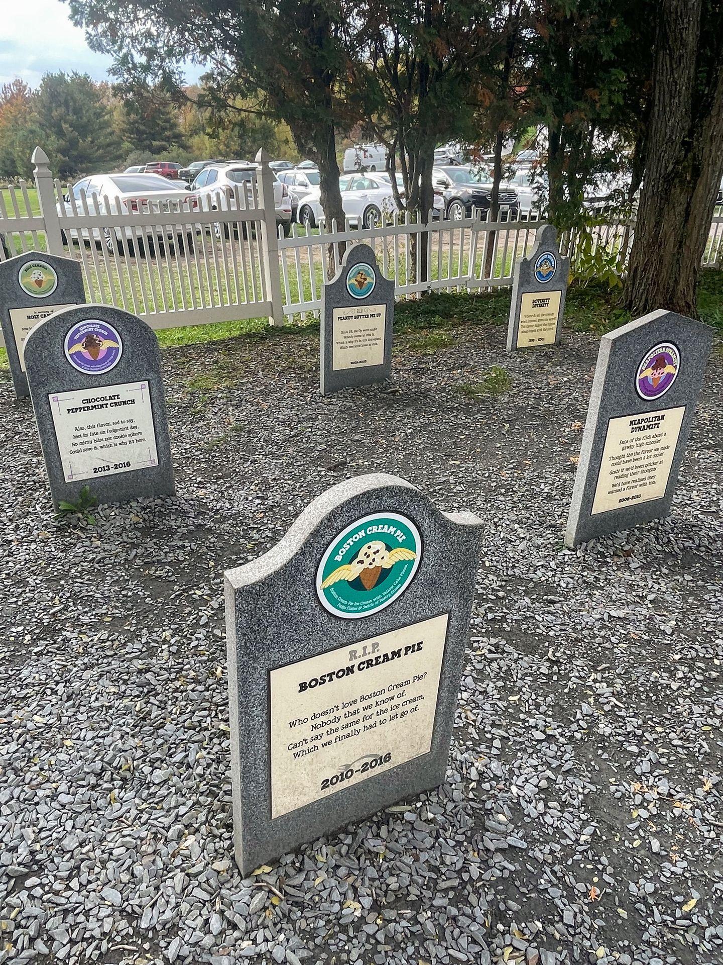 A series of gravestones that depict former ice cream flavors from Ben and Jerry's