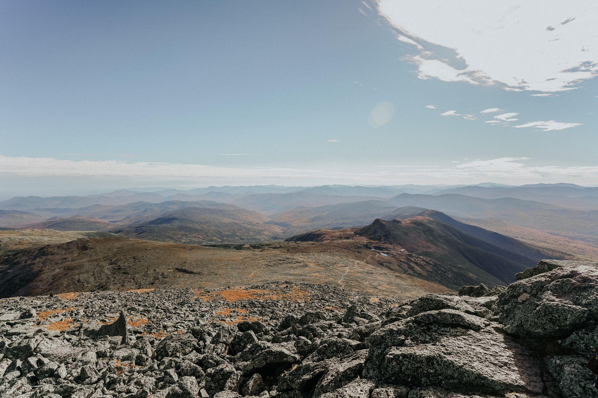 An expansive view of mountains taken from the top of Mt Washington, the highest point in the Northeast.
