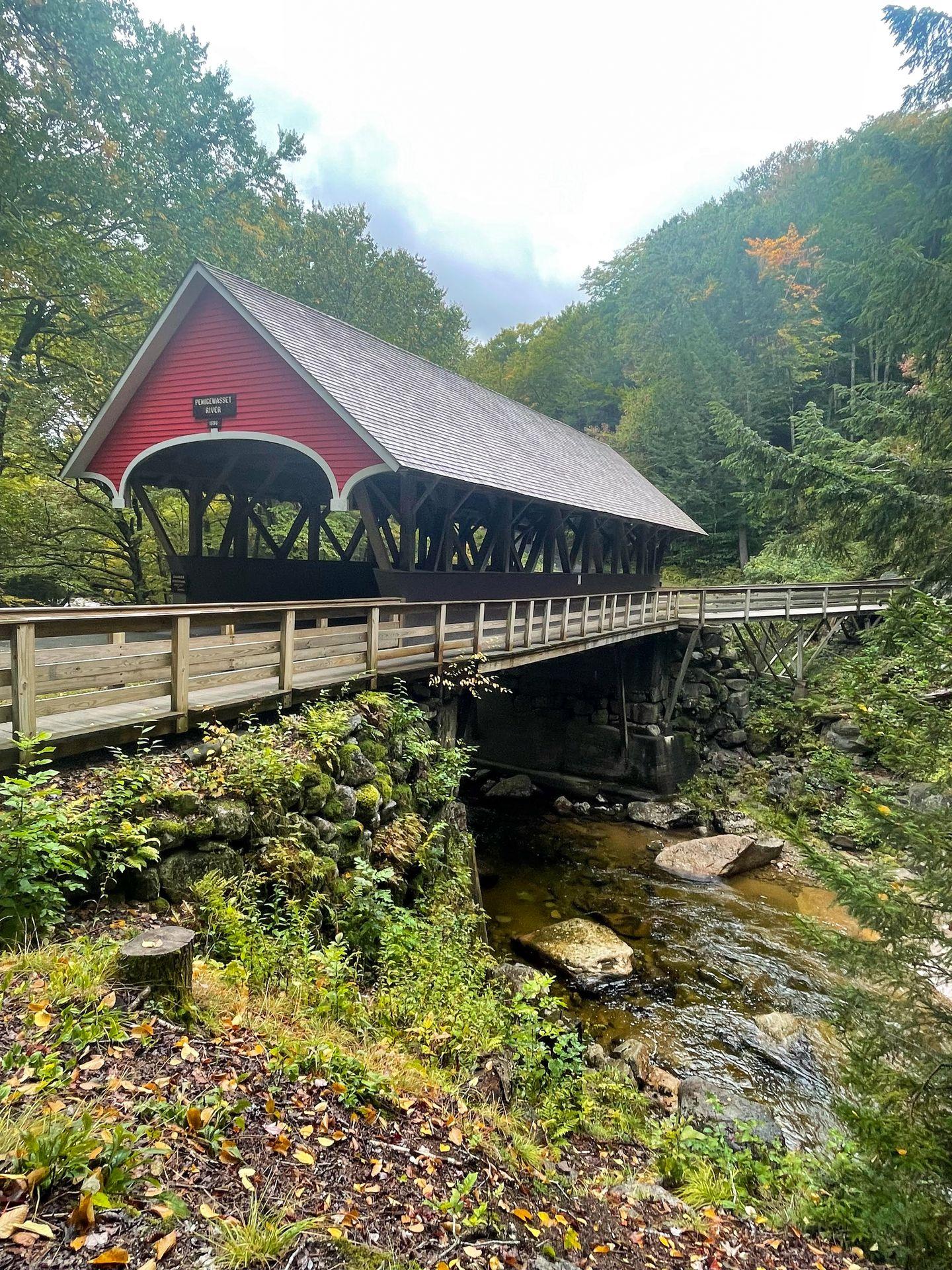 A red covered bridge on the Flume Gorge trail.
