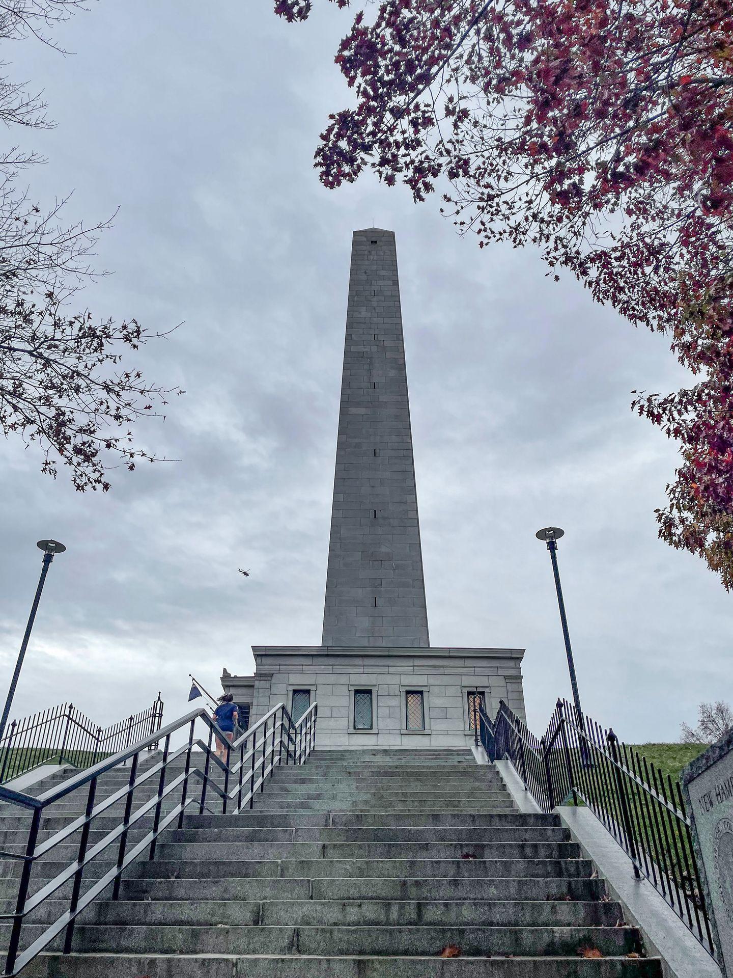 Looking up the Bunker Hill Monument. Several steps lead up to the base of the monument.