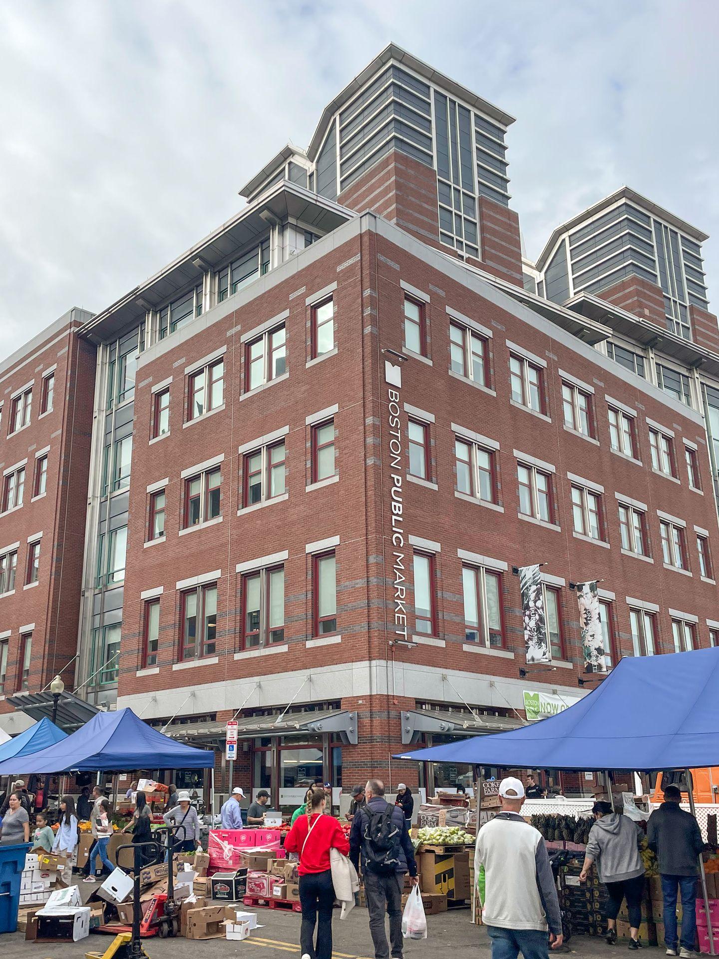 The exterior of the Boston Public Market, a large brick building.