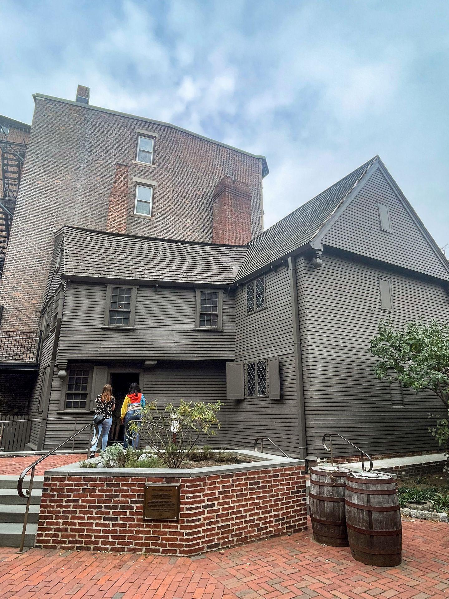 An outside view of the Paul Revere House. The building is gray.