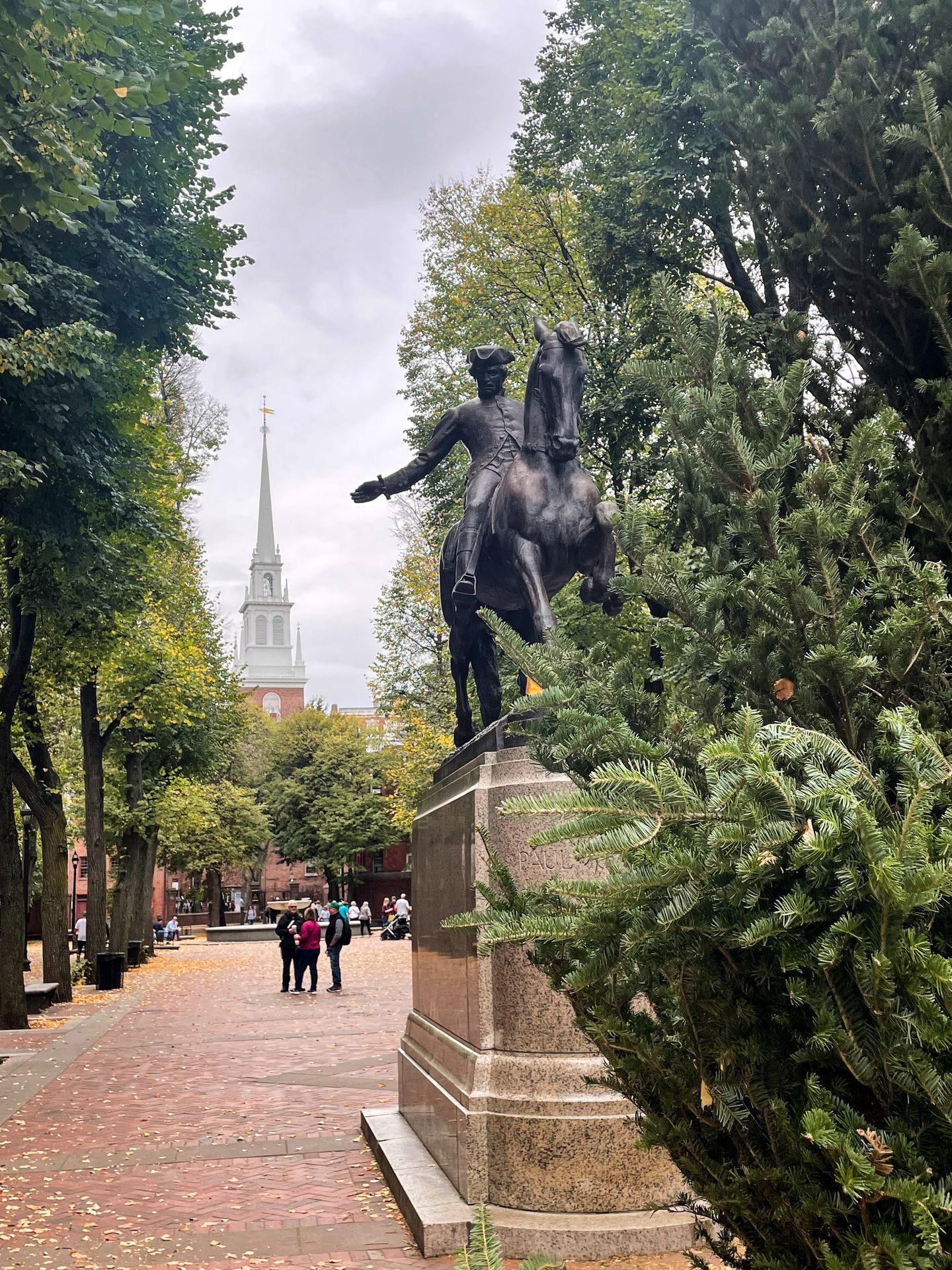 A statue of Paul Revere on a horse in the Paul Revere Mall