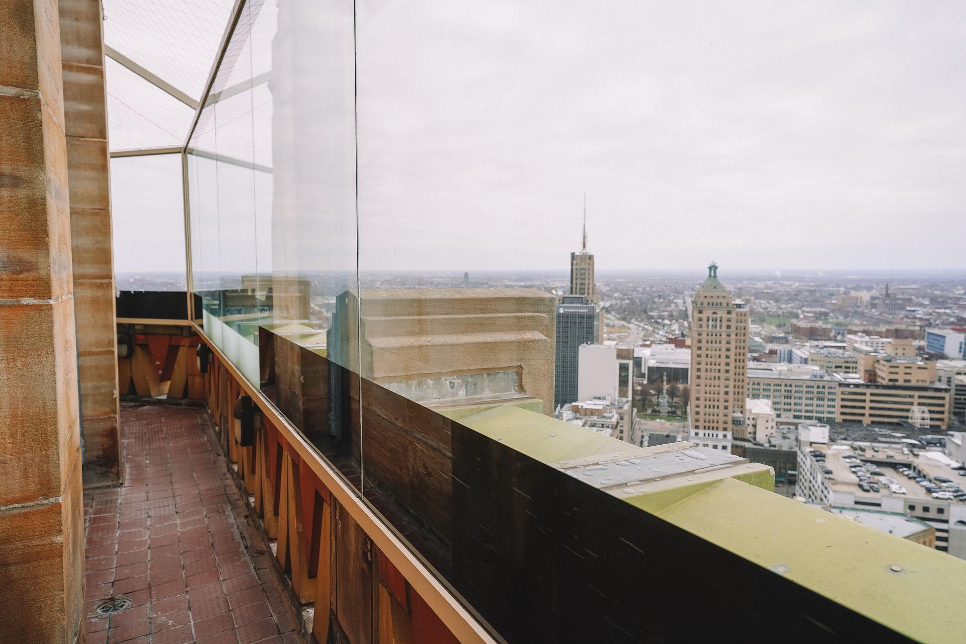 A view from the observation deck of the City Hall Observation Tower in Buffalo. A sheet of glass is between the viewing deck and the open air.