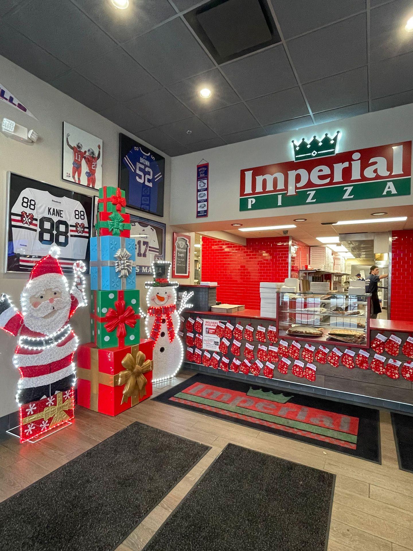 The interior of Imperial Pizza with Christmas decor.