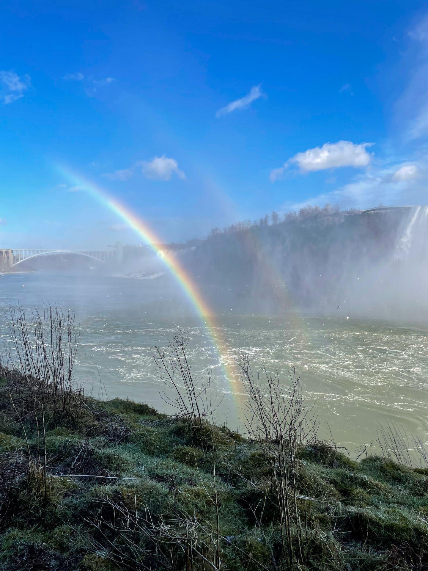 A view of the Niagara River and several rainbows.