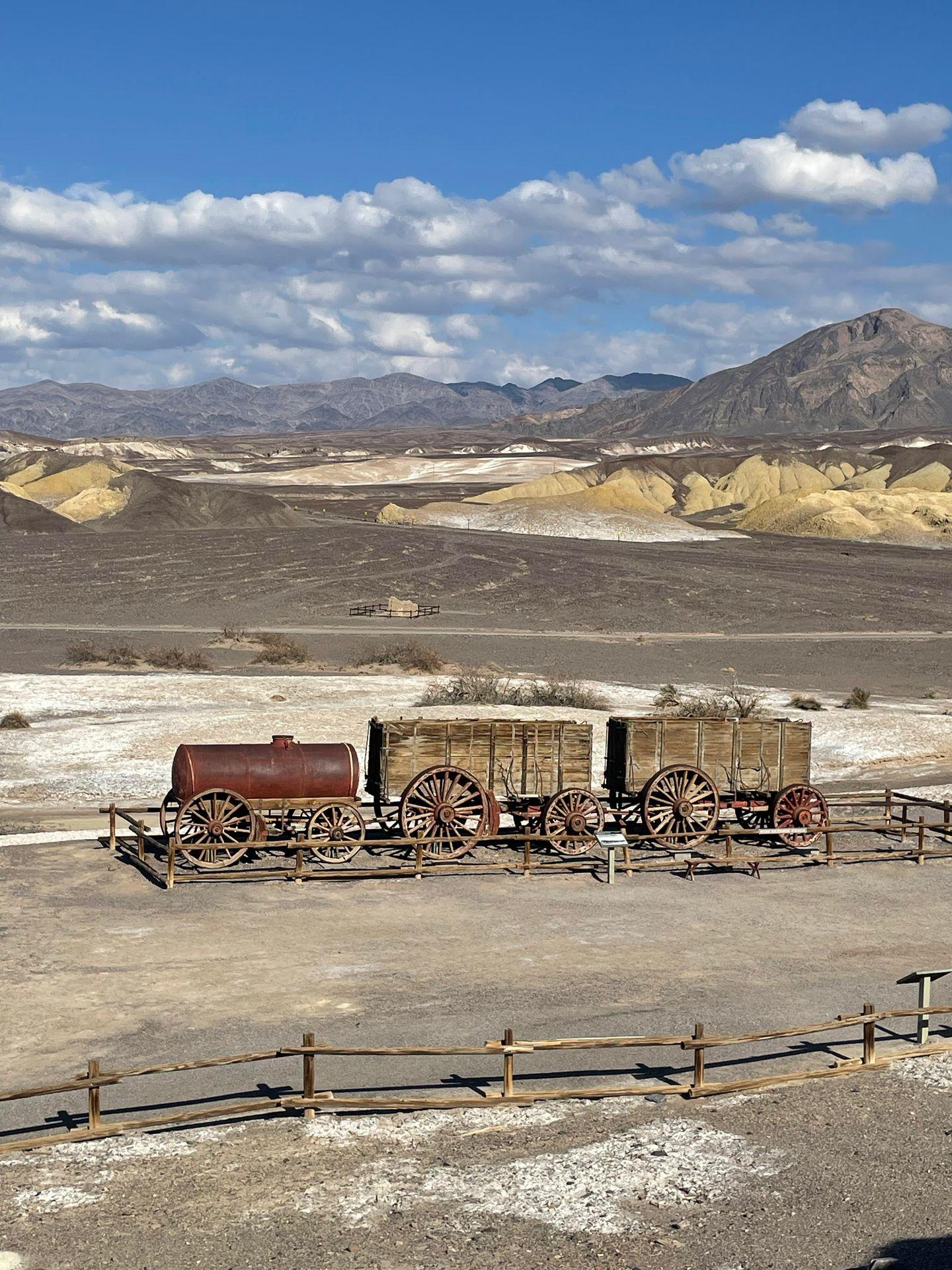 A tank and other items that were used to transport items related to Borax mining in Death Valley.