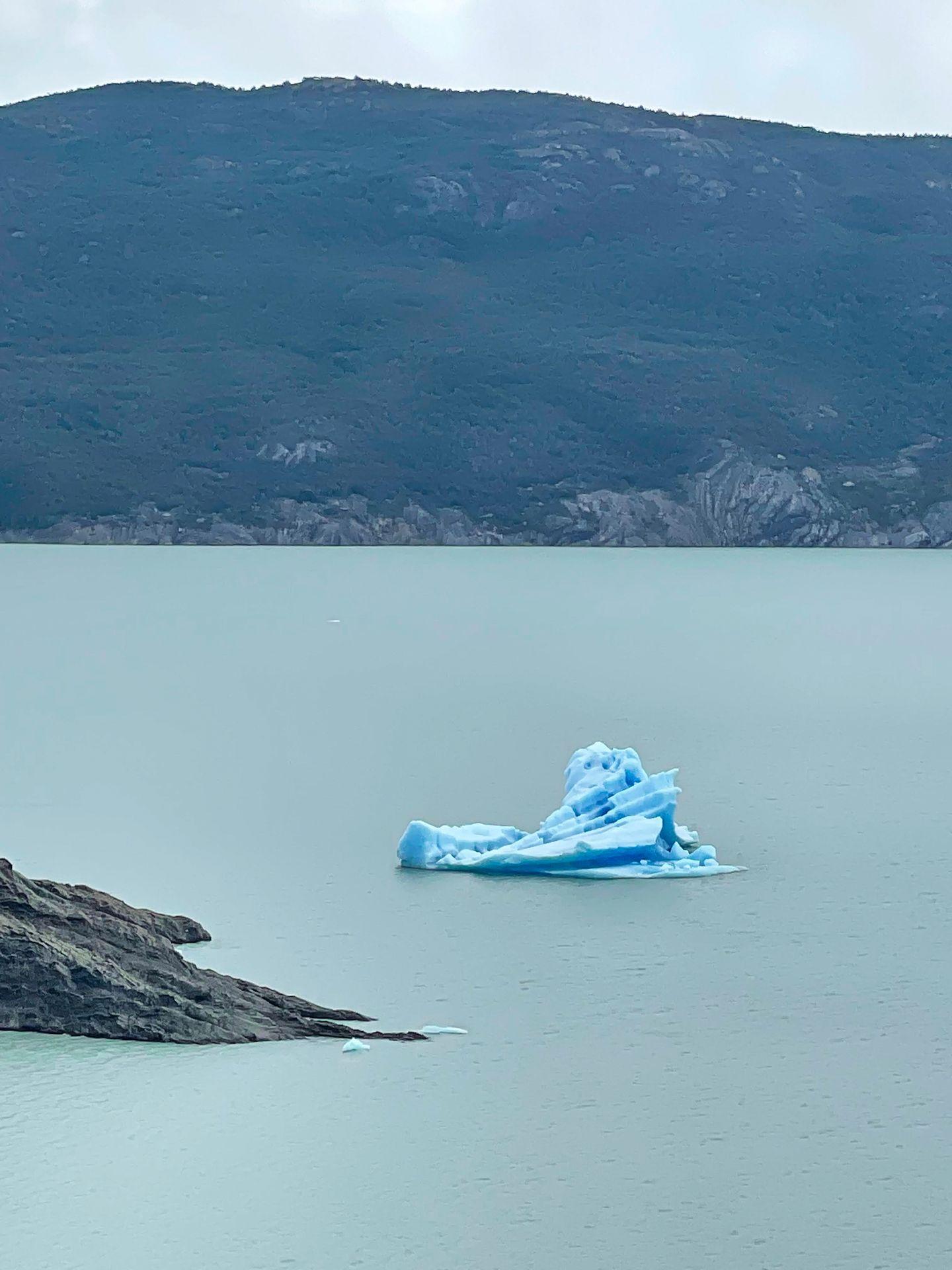 A small iceberg floating on a Lake Grey.