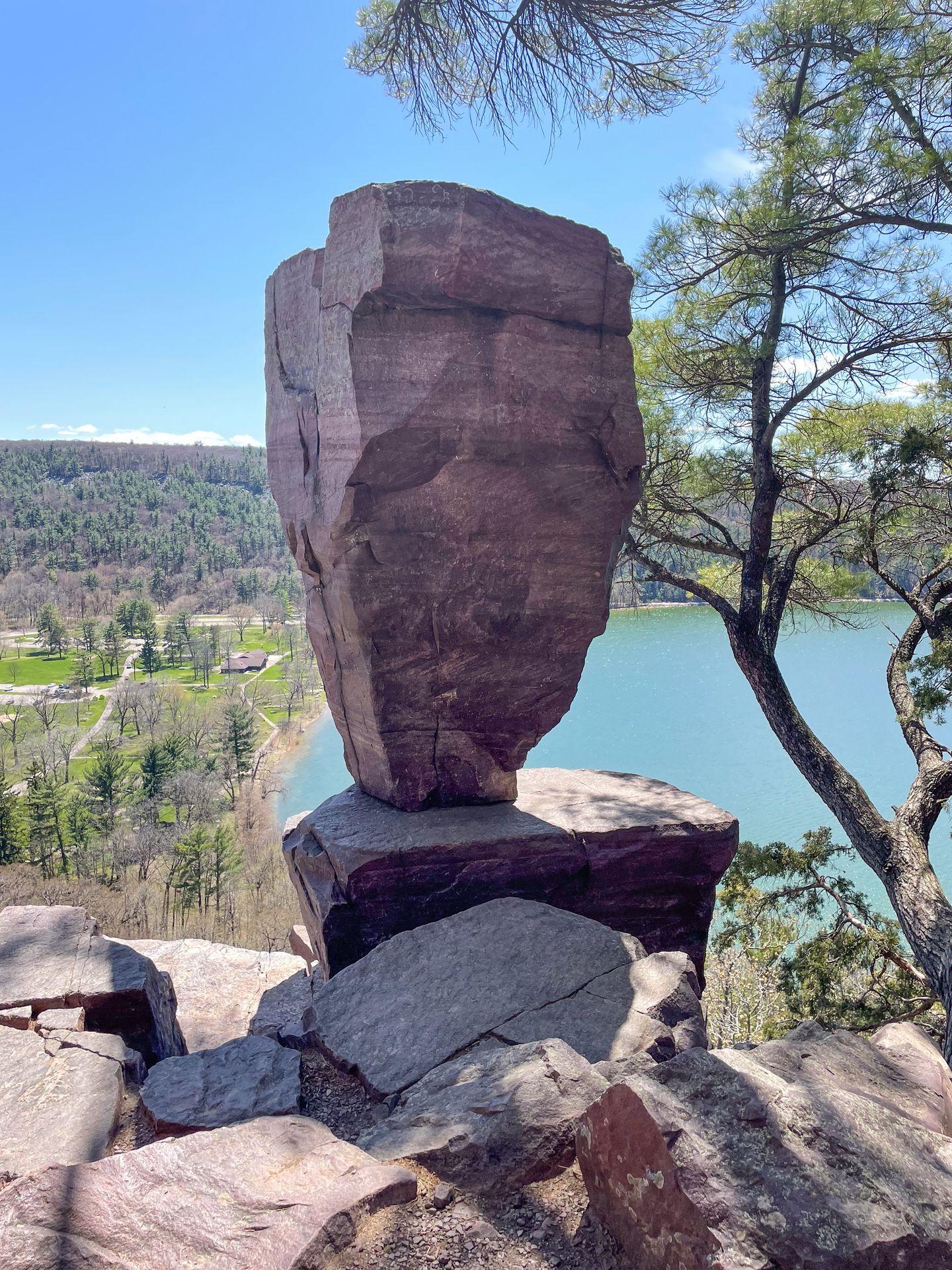 A giant rock that looks as if it's balancing on a narrow section.