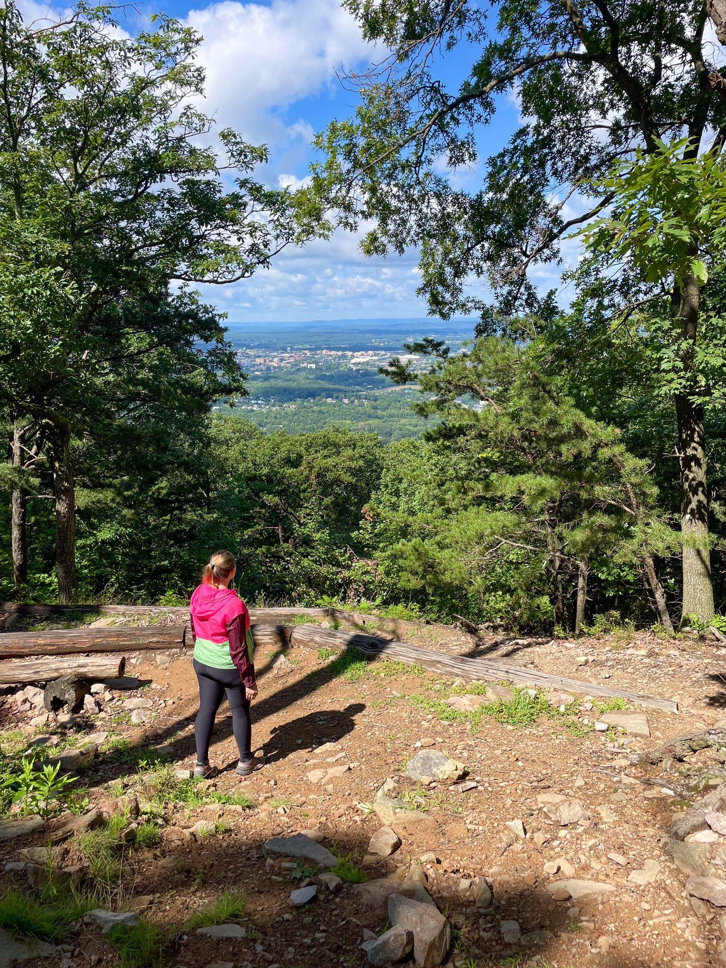 Lydia gazing at the of Penn State from the Mike Lynch Overlook on the Mount Nittany Trail.
