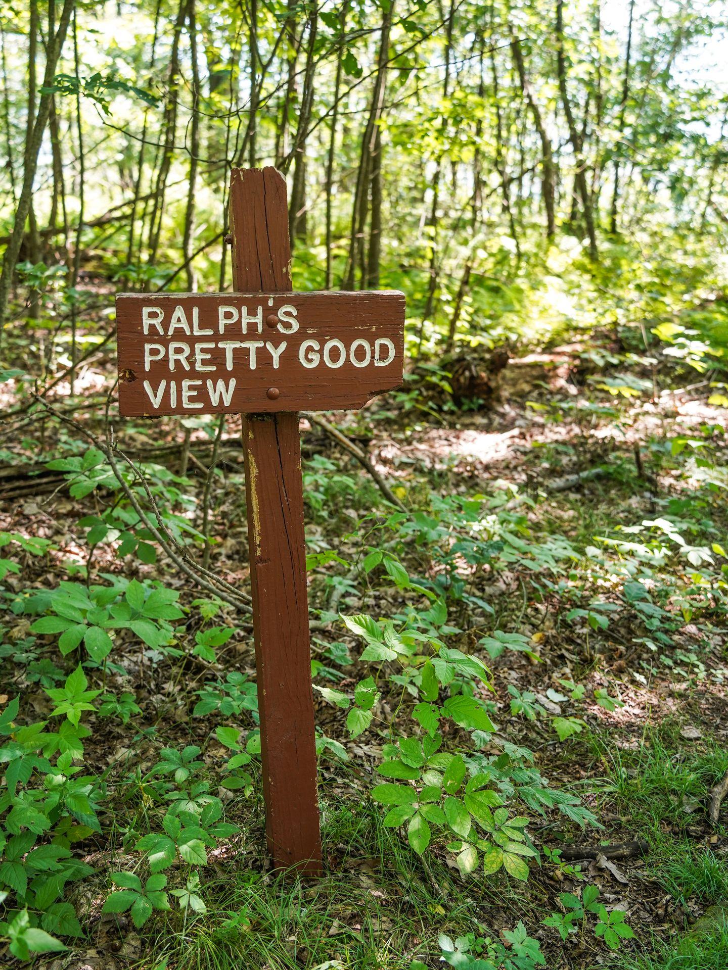 A wooden sign that reads "Ralph's Pretty Good View"