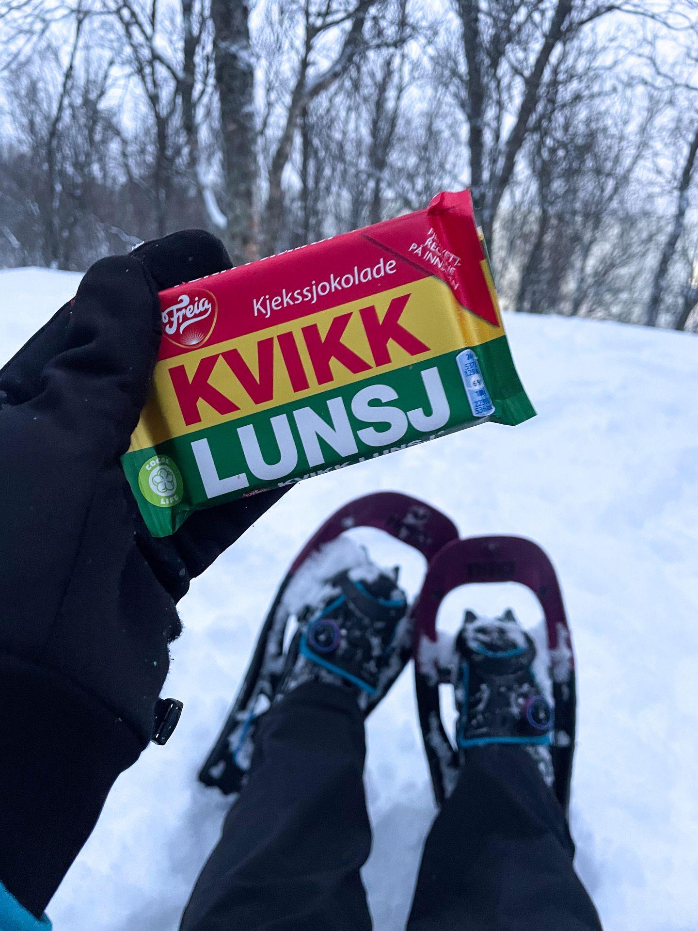 Holding on Norwegian chocolate (Kvikk Lunsj) while snowshoeing