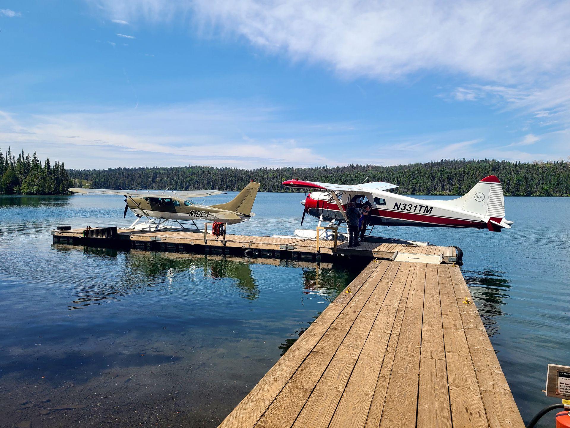 Two seaplanes parked at the Rock harbor dock on Isle Royale