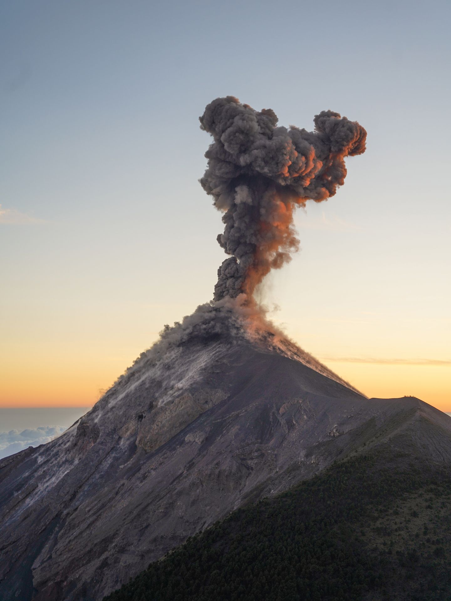 Fuego mid-eruption, with a big plume of smoke above it