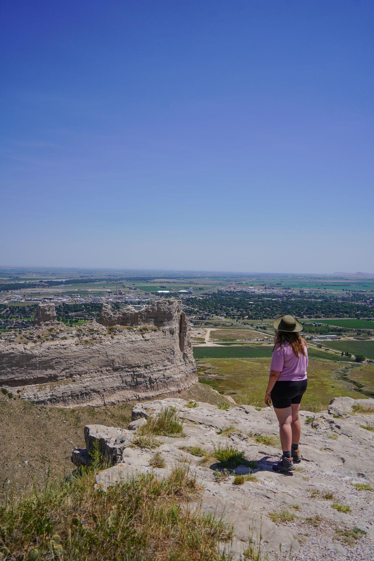 Lydia looking out at the views from the South Overlook at Scotts Bluff National Monument