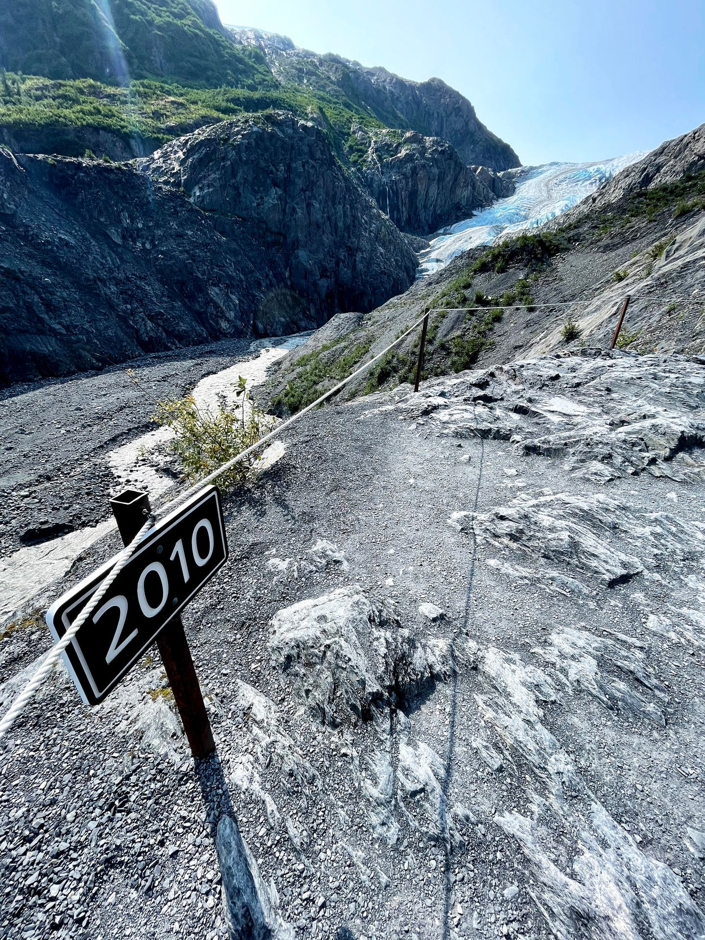 Exit Glacier with a sign for '2010' way out in front of the glacier.