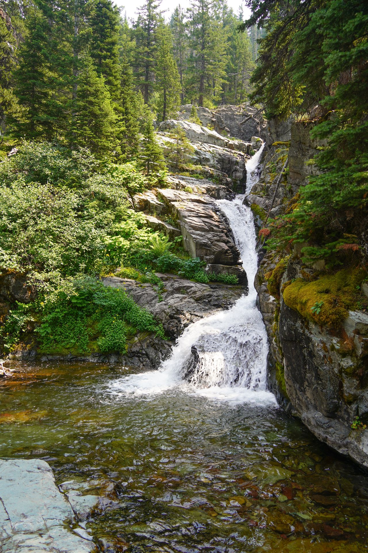 A waterfall cascading down a rocky facade.