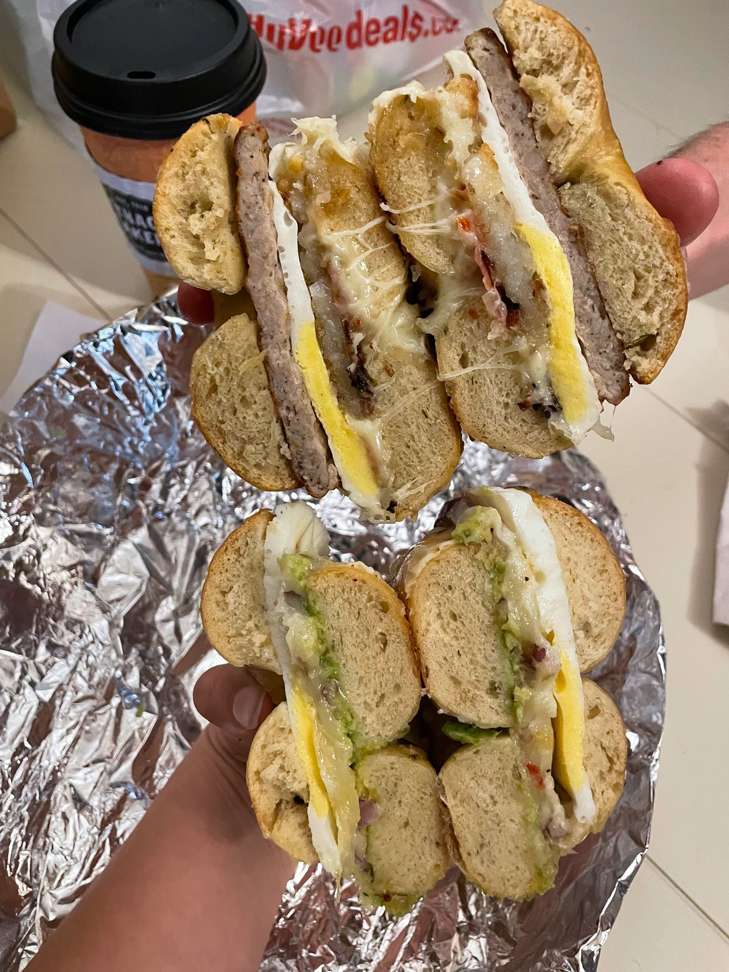 Two tables split in half that have eggs and other fillings.