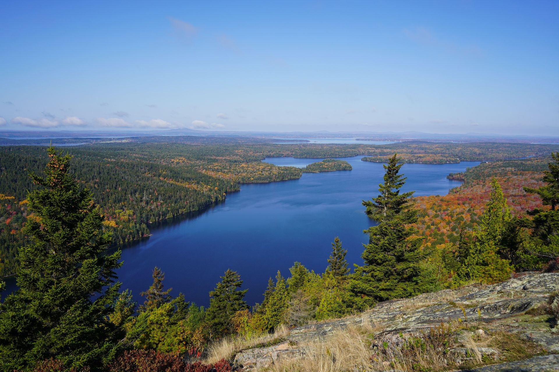Views of a lake and water from the trail up to Beech Mountain.