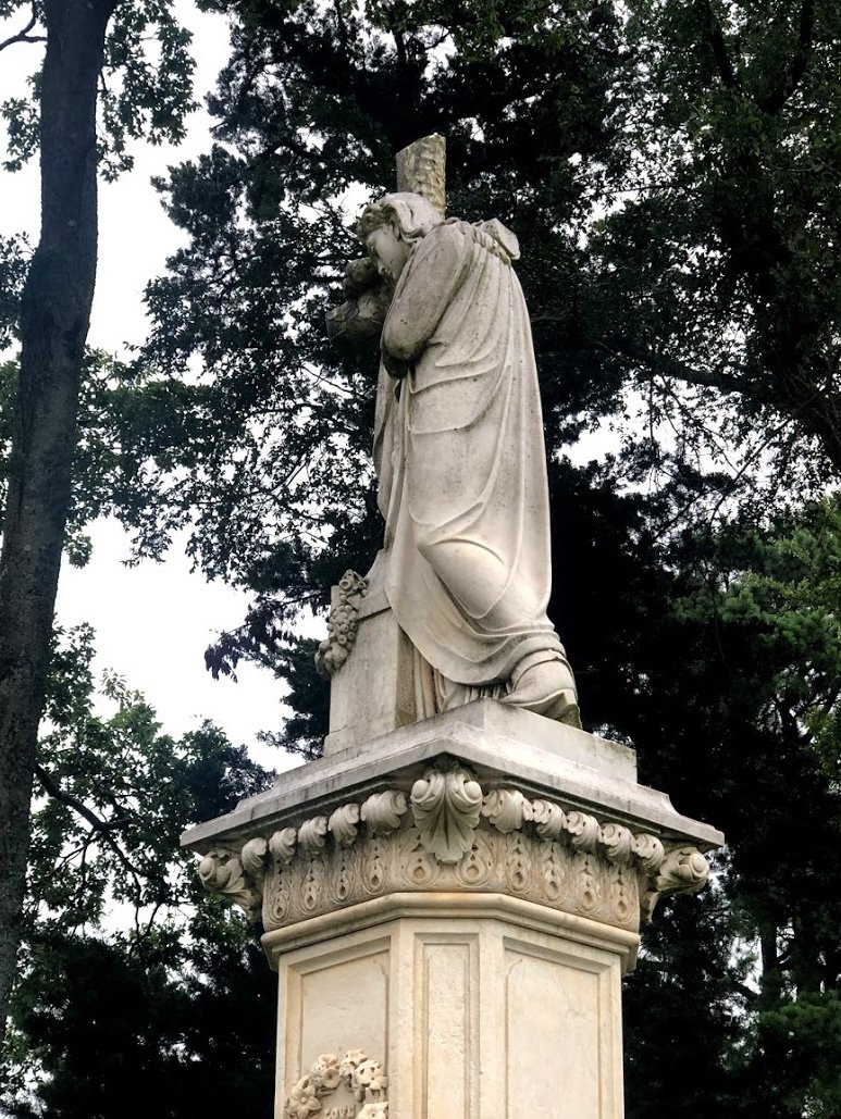 A close up view of Jesus wearing cowboy boots.