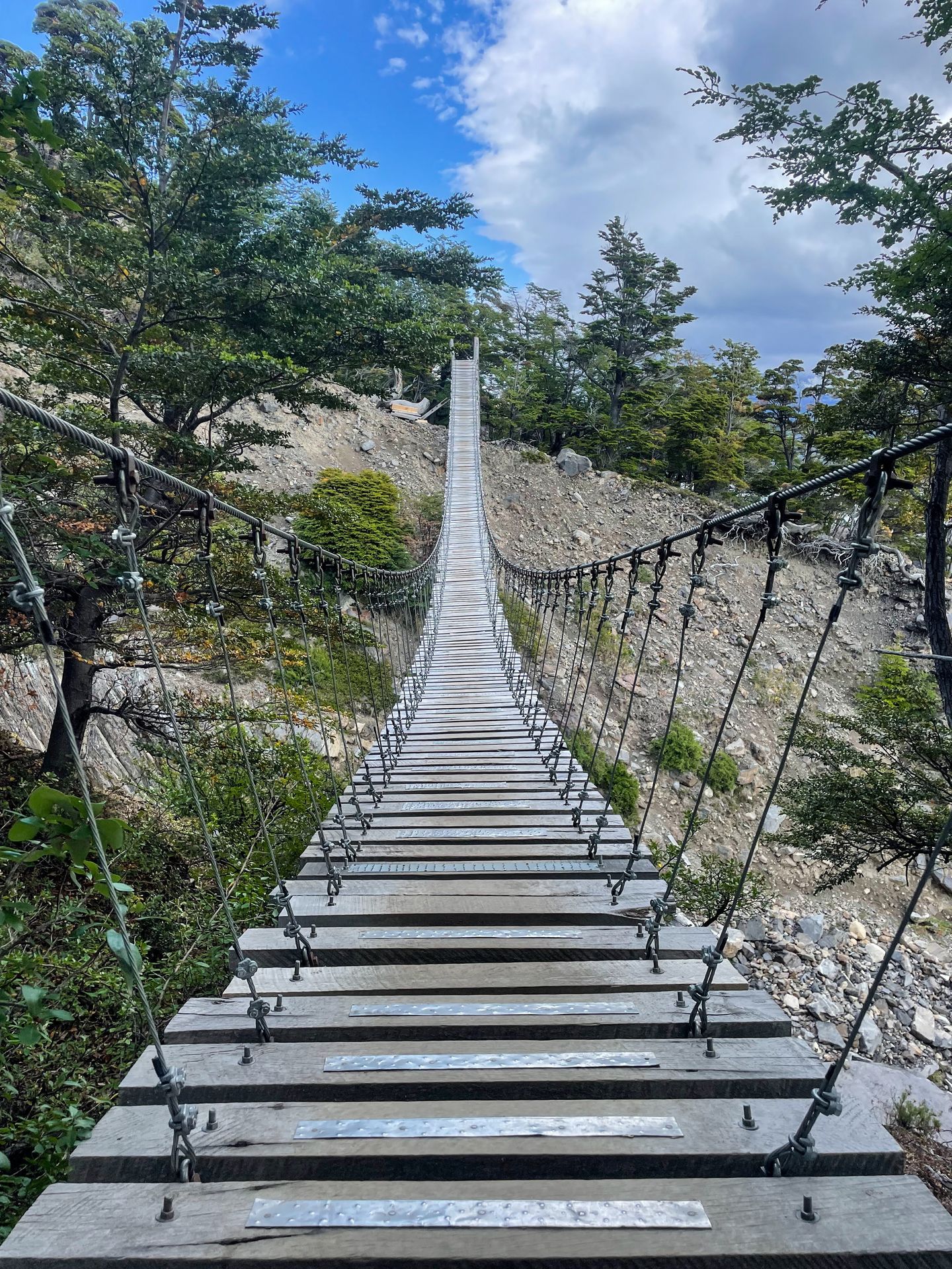 A view looking straight across a suspension bridge.