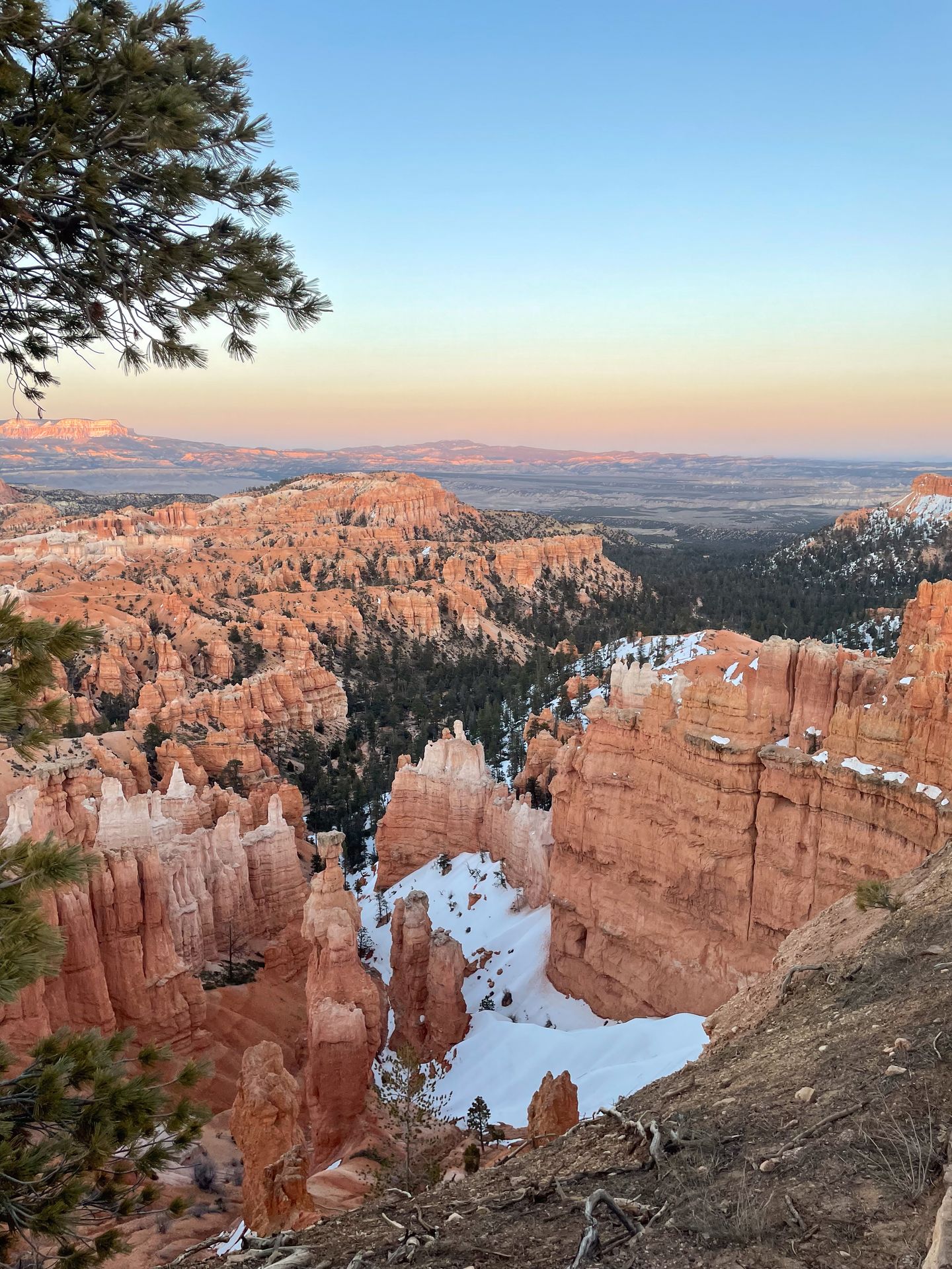 A view of Bryce Canyon National Park with a bit of snow at sunrise