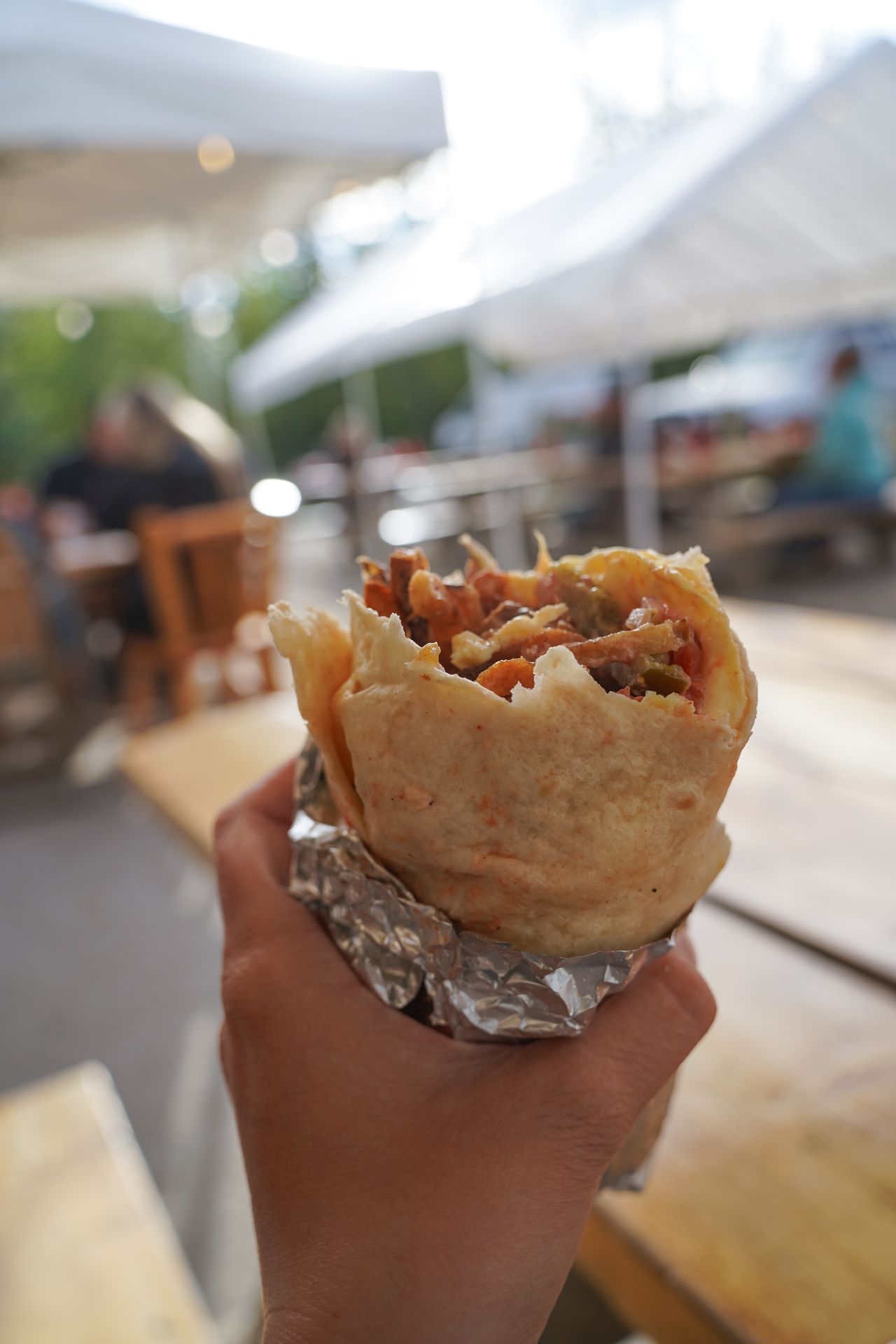 Holding a burrito from The Potato in McCarthy