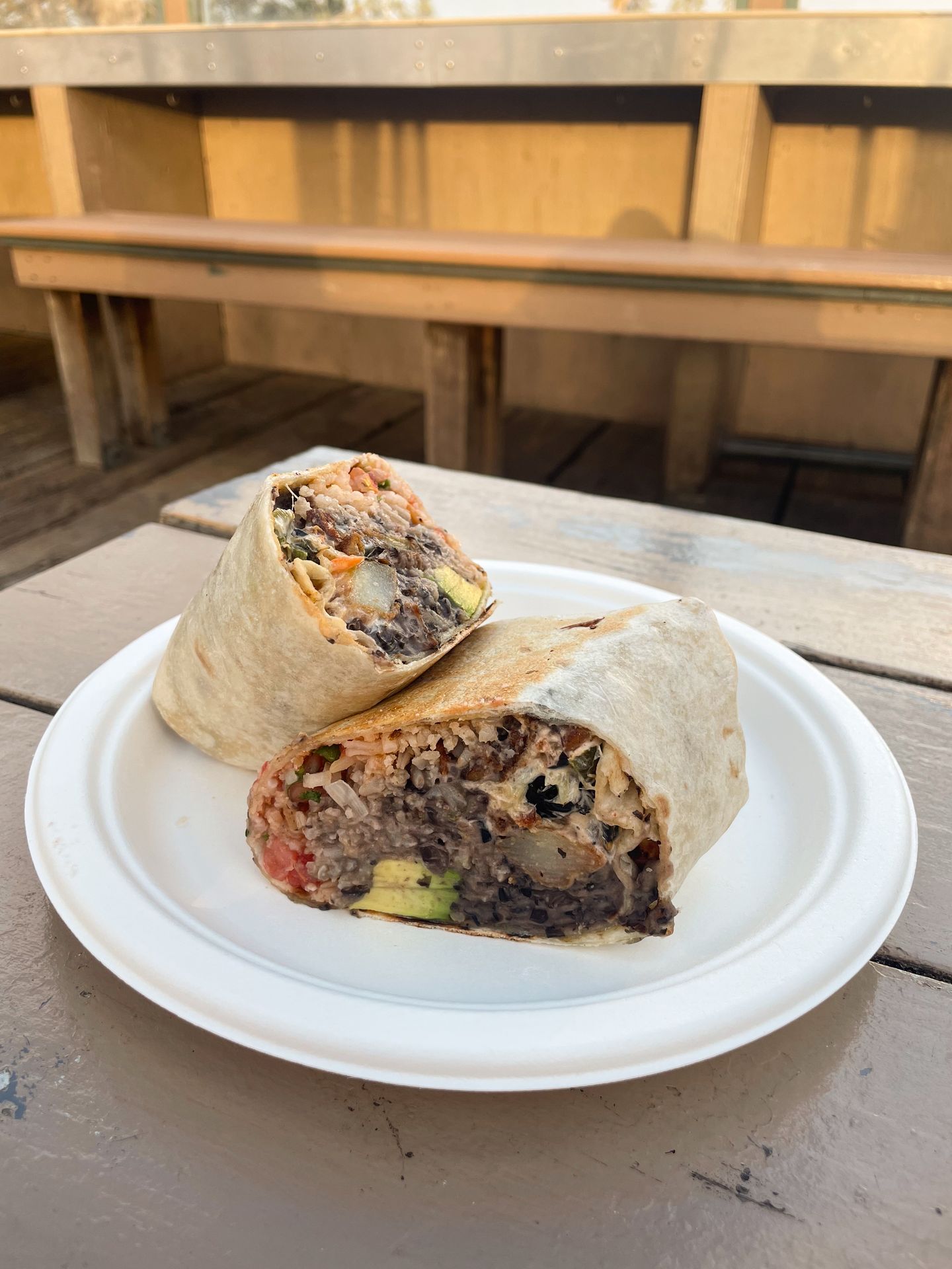A burrito cut in half from Beach House Tacos