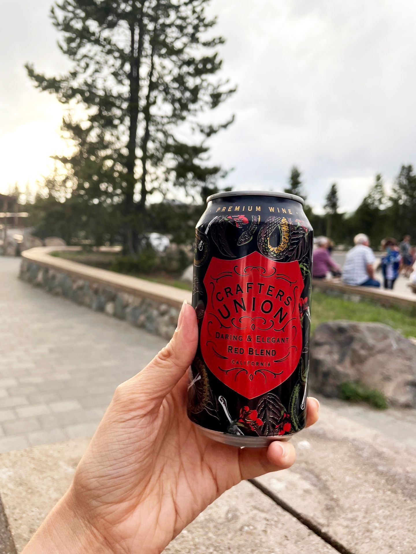 Holding up a can of beer outside of Canyon Eatery