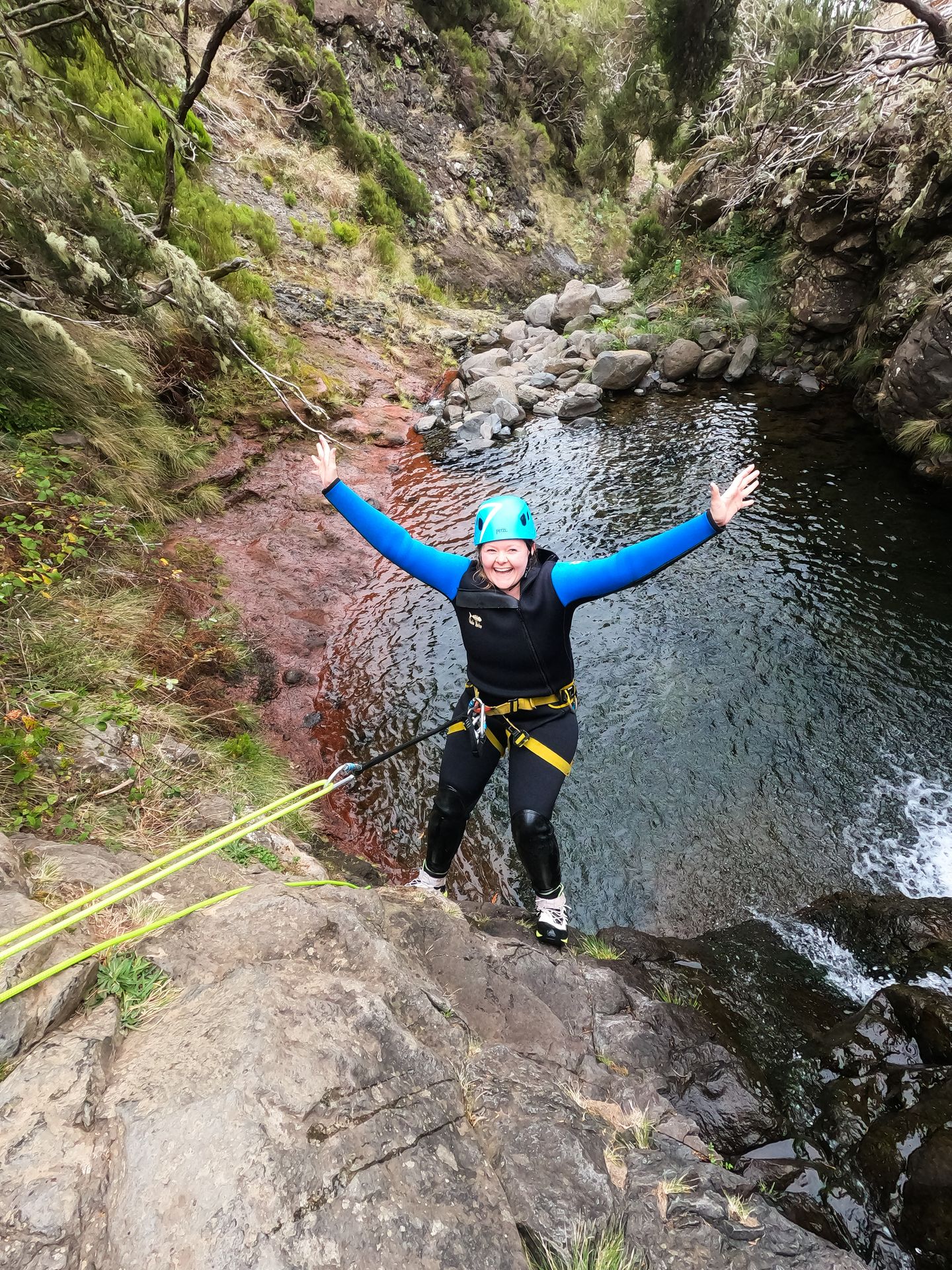 Lydia rapelling down a waterfall in Madeira