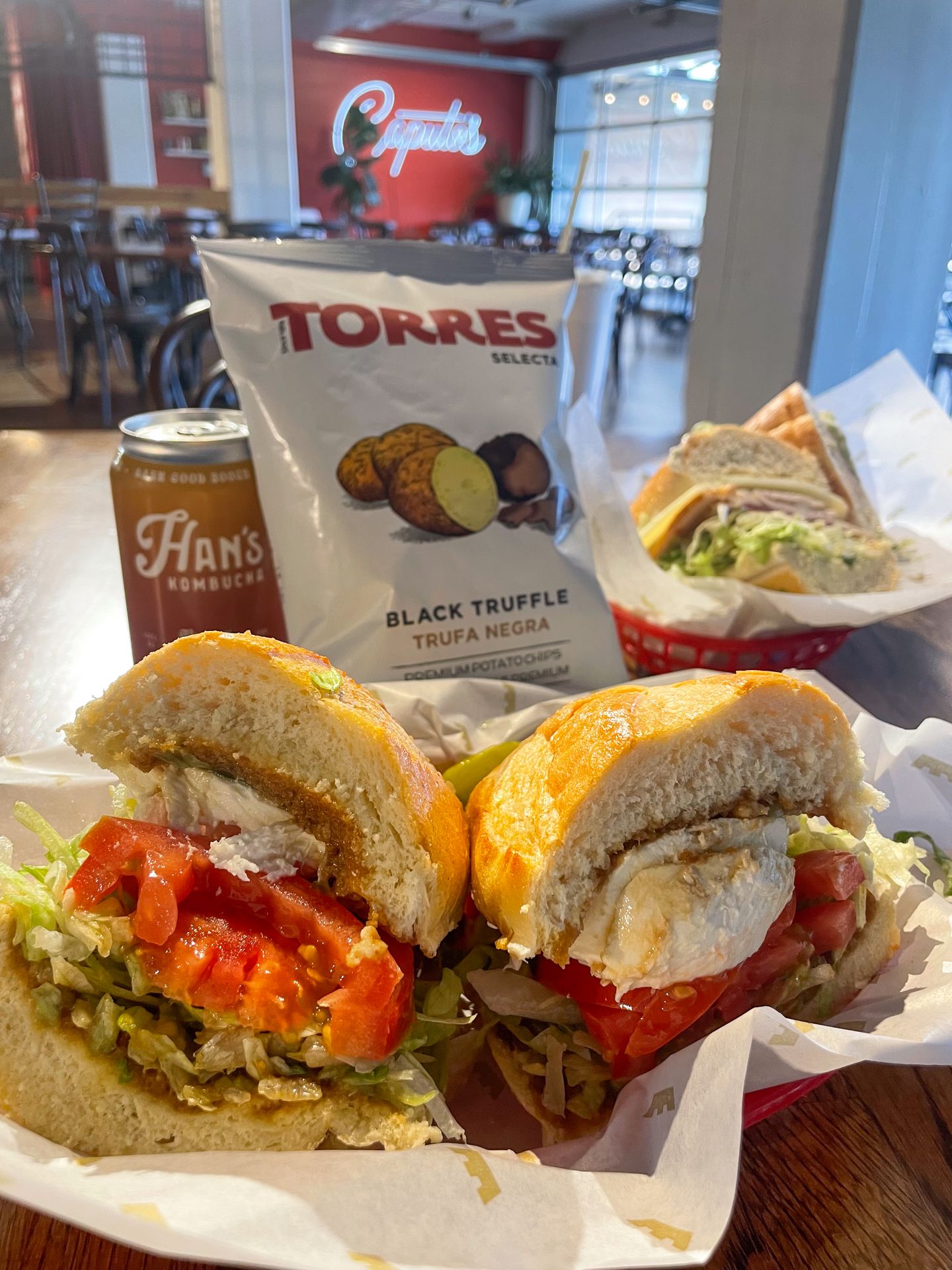 The fior di latte sandwich and a bag of truffle chips from Caputo's