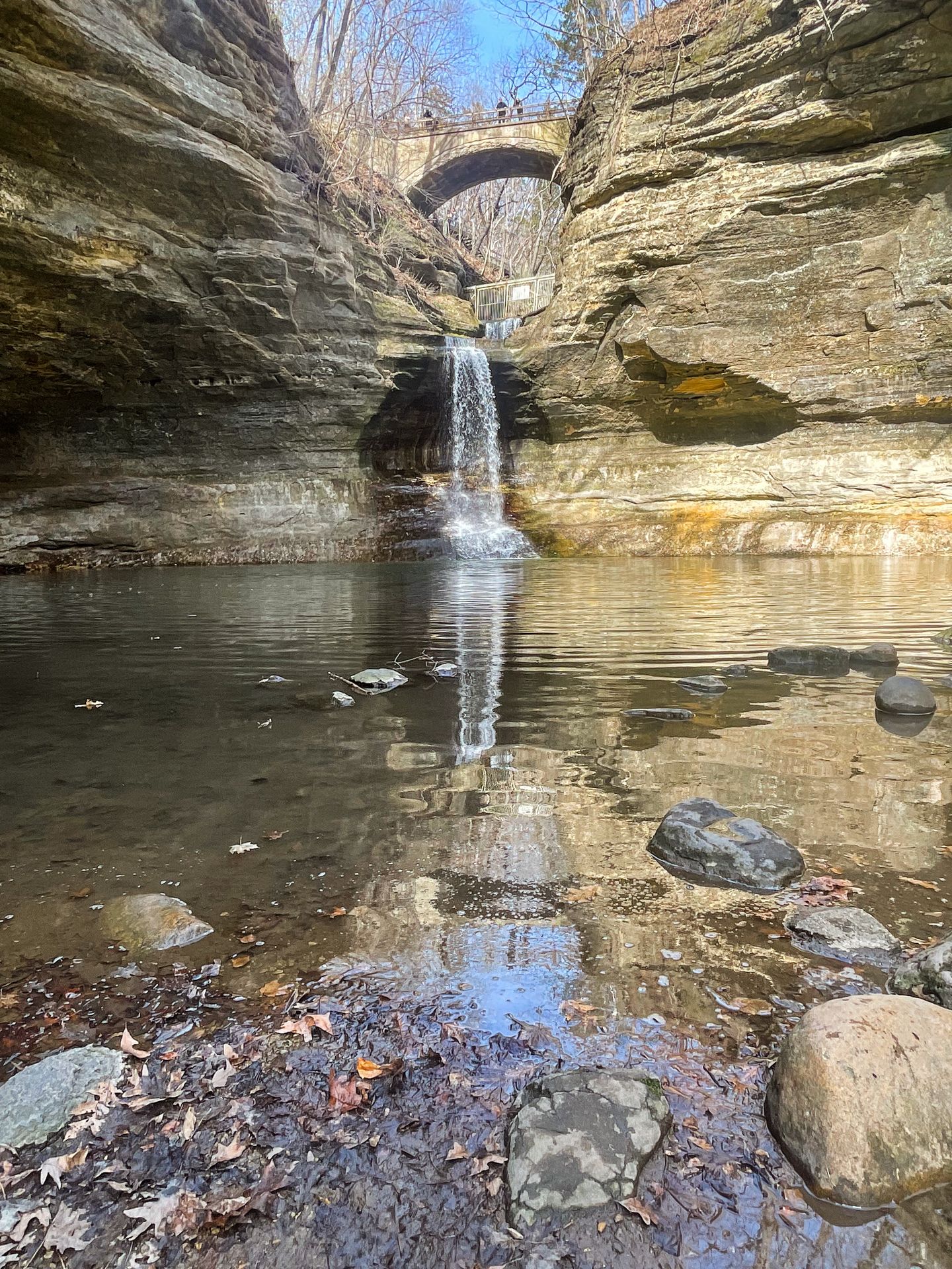 A waterfall underneath a bridge in Matthiessen State Park