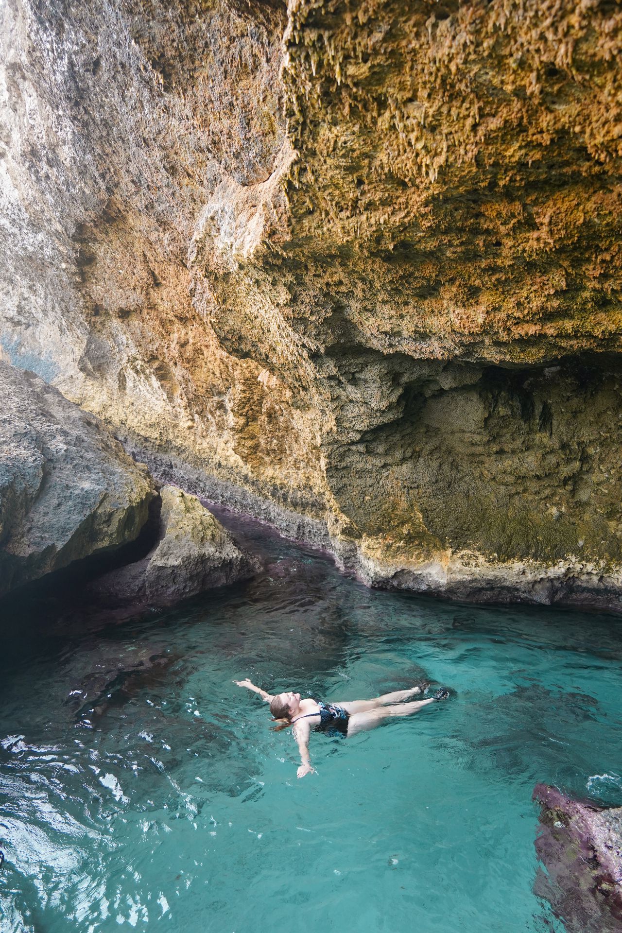 Lydia swimming in the Aruba Cave Pool