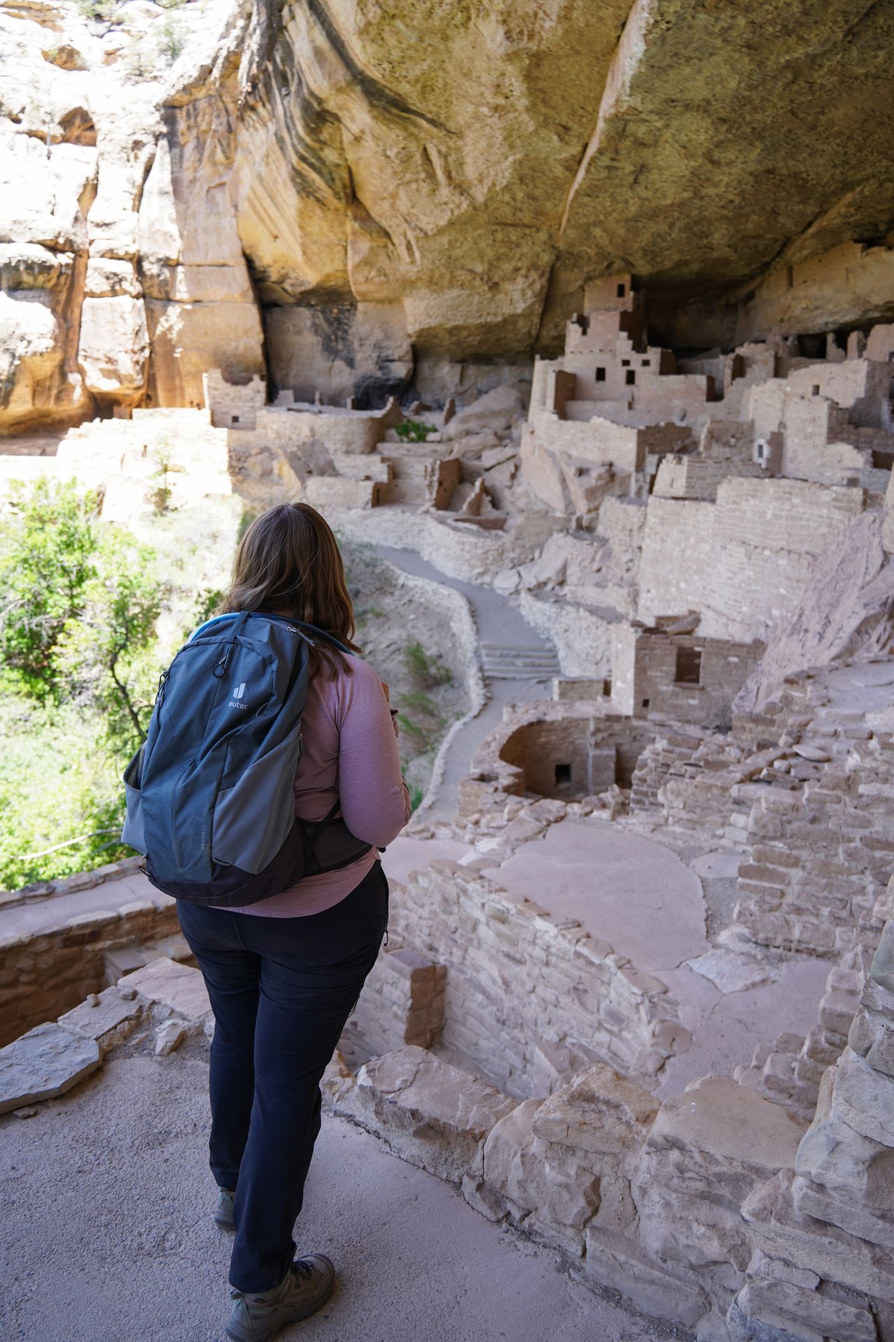 Lydia looking out at the various structures inside of Cliff Palace